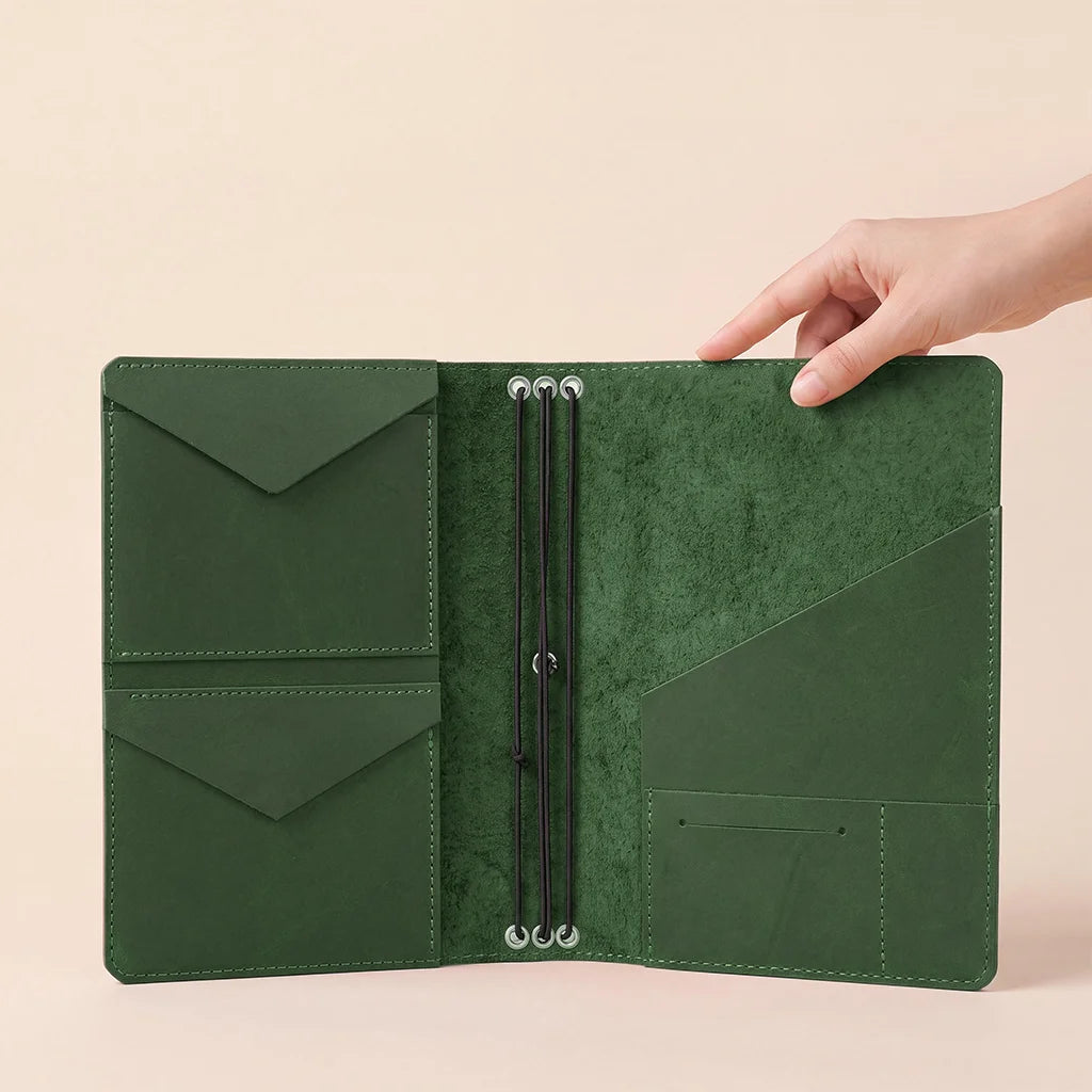 Leather journal organizer with handcrafted details, elastic bands, and convenient storage sections.