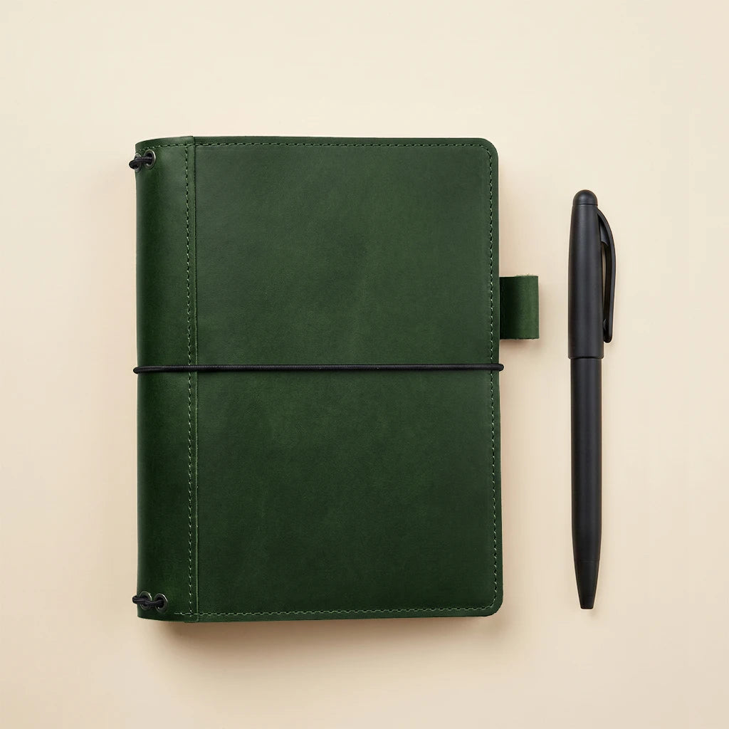 Handmade leather journal organizer featuring interior pockets and elastic notebook system