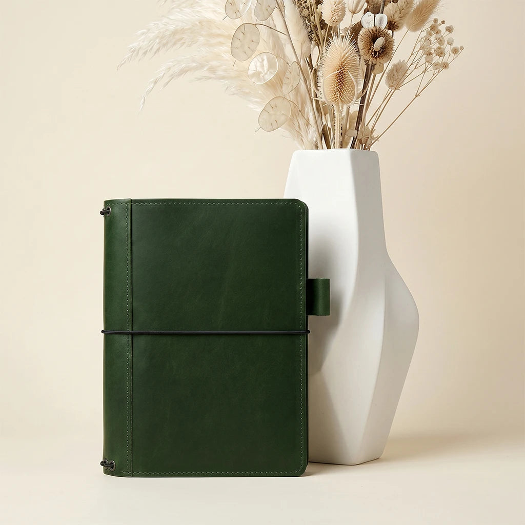 Stylish leather journal cover with internal pockets and multiple elastic bands