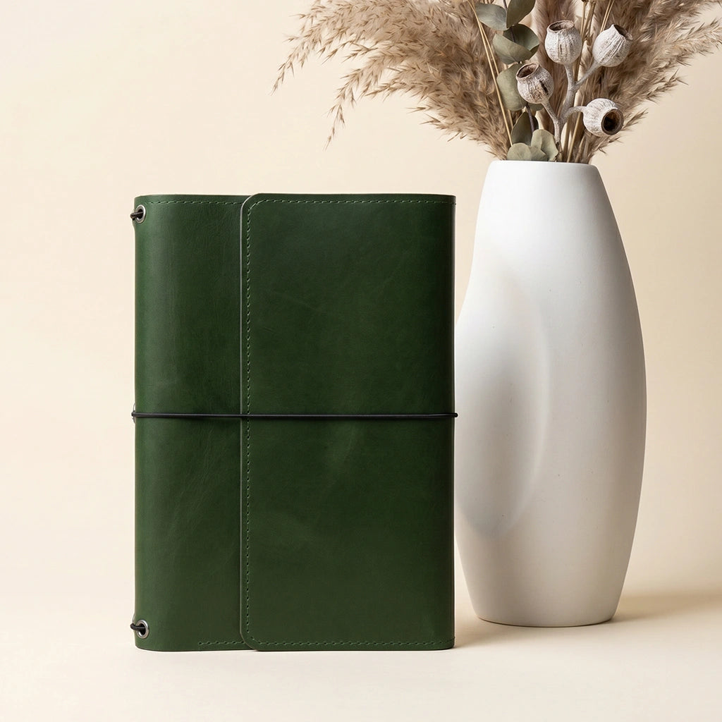 Handmade leather notebook folio featuring practical card slots and flexible notebook elastics.