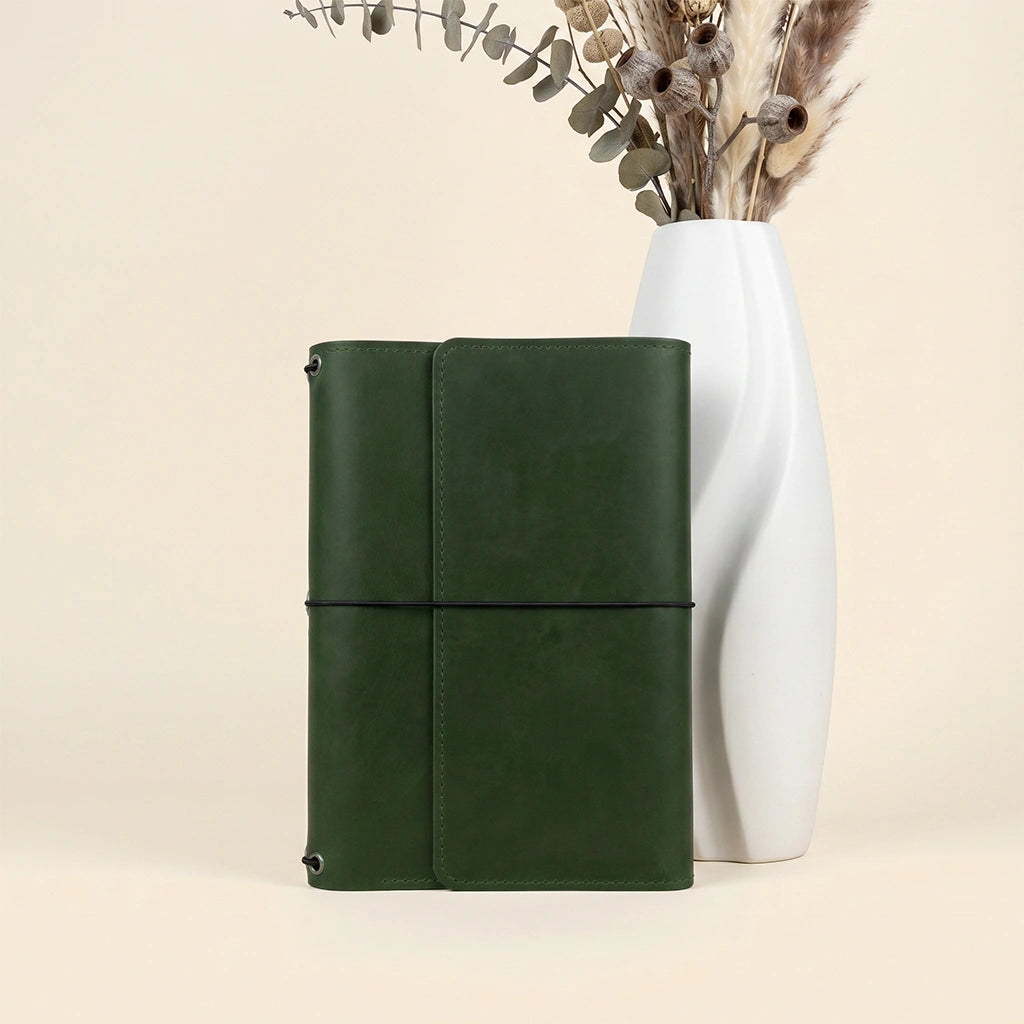 Handmade leather notebook cover with spacious organizer interior and premium construction.