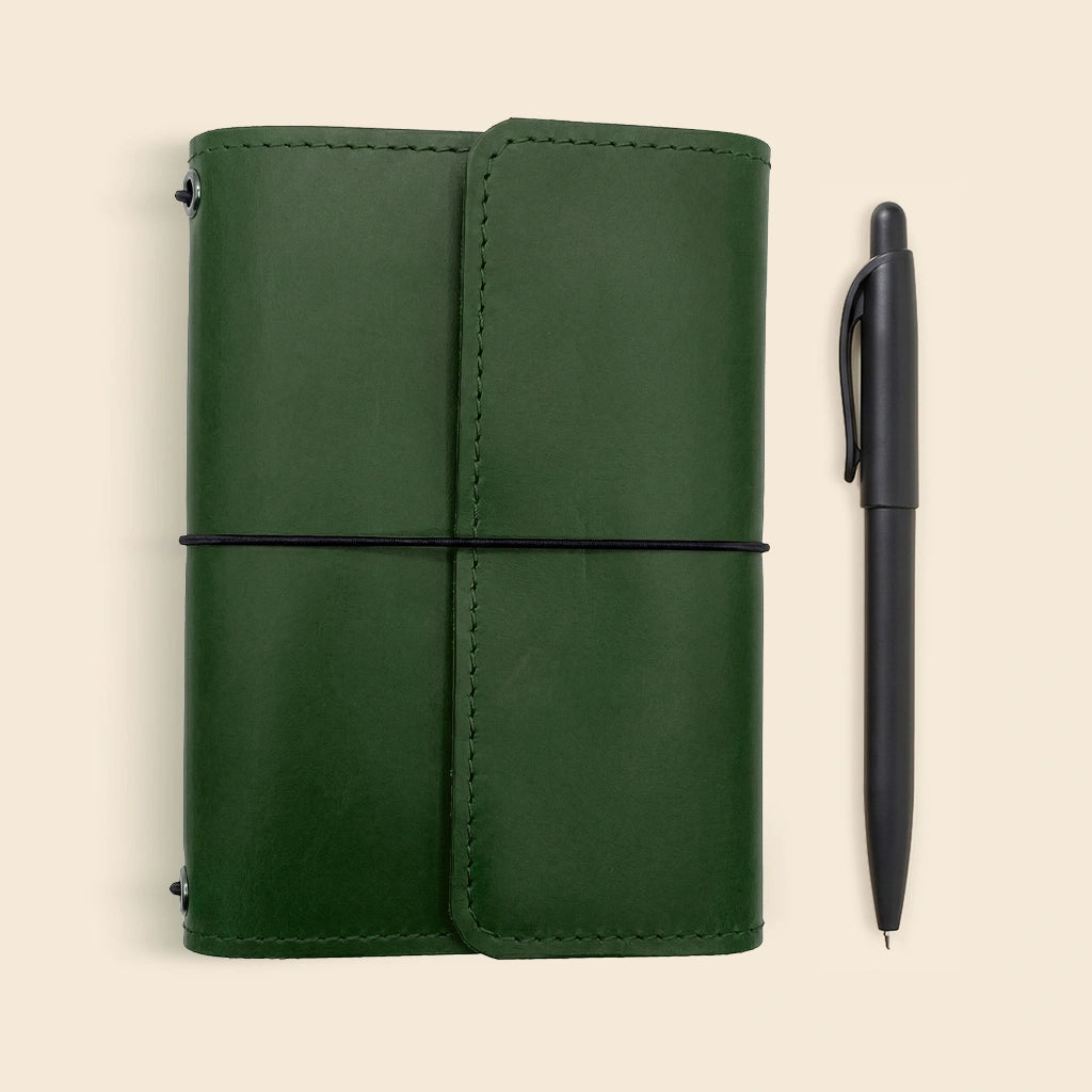 Premium leather notebook case with pen loop and refillable journal attachment bands.