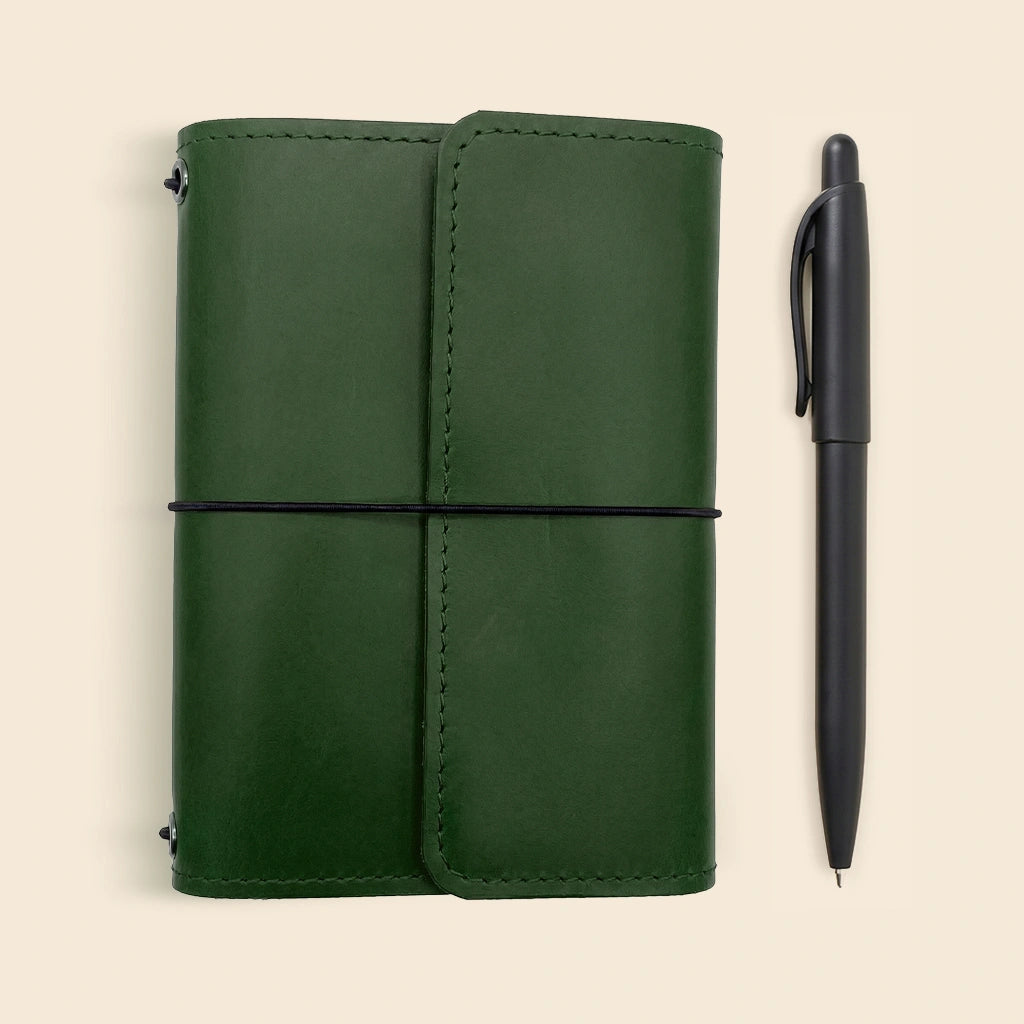 Genuine leather notebook organizer with refillable notebook system and storage compartments.