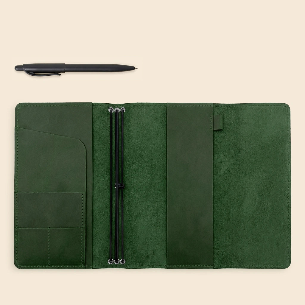 Minimal leather notebook case with built-in organizer pockets and elastic retention bands.
