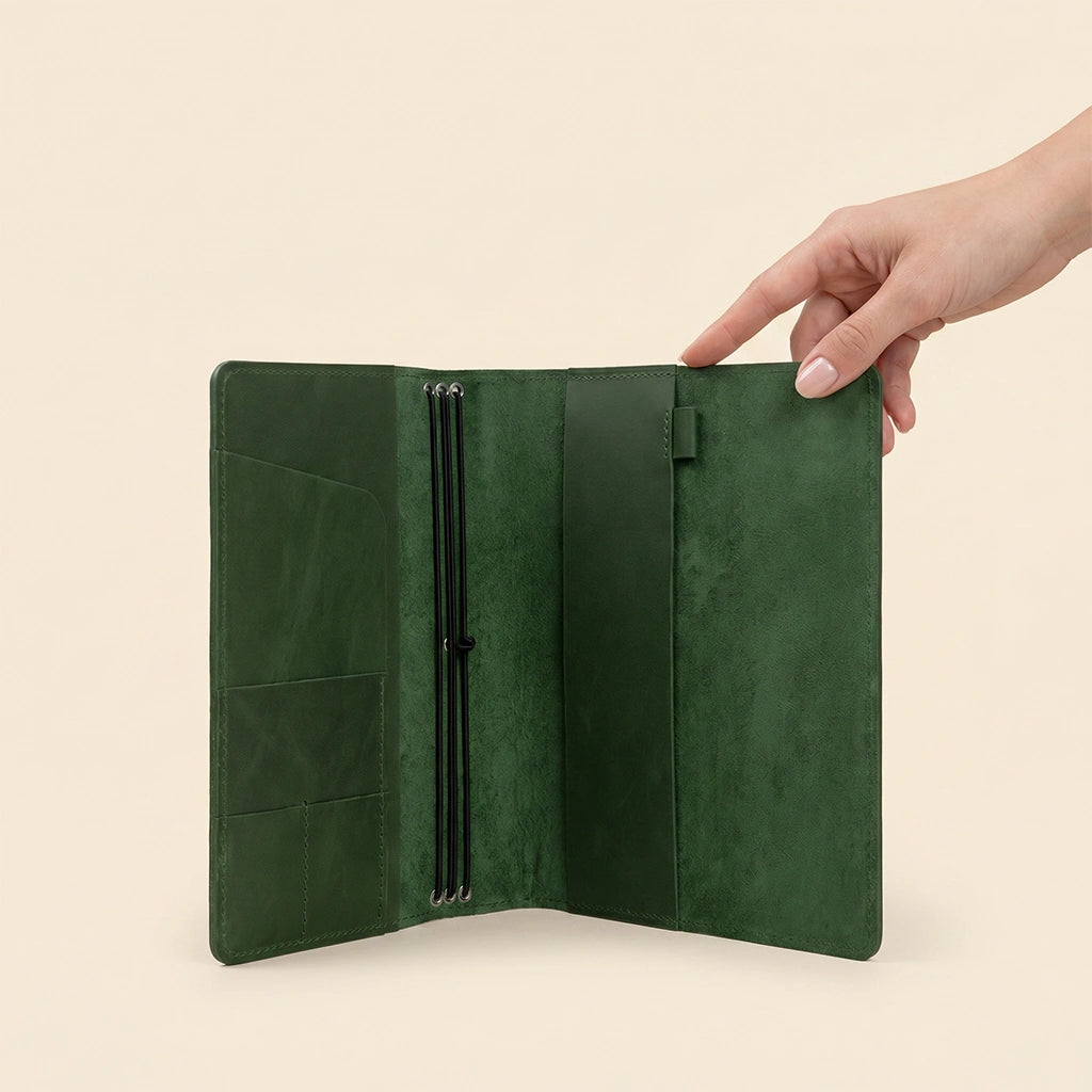 Leather refillable notebook cover with handcrafted details and organized interior compartments.
