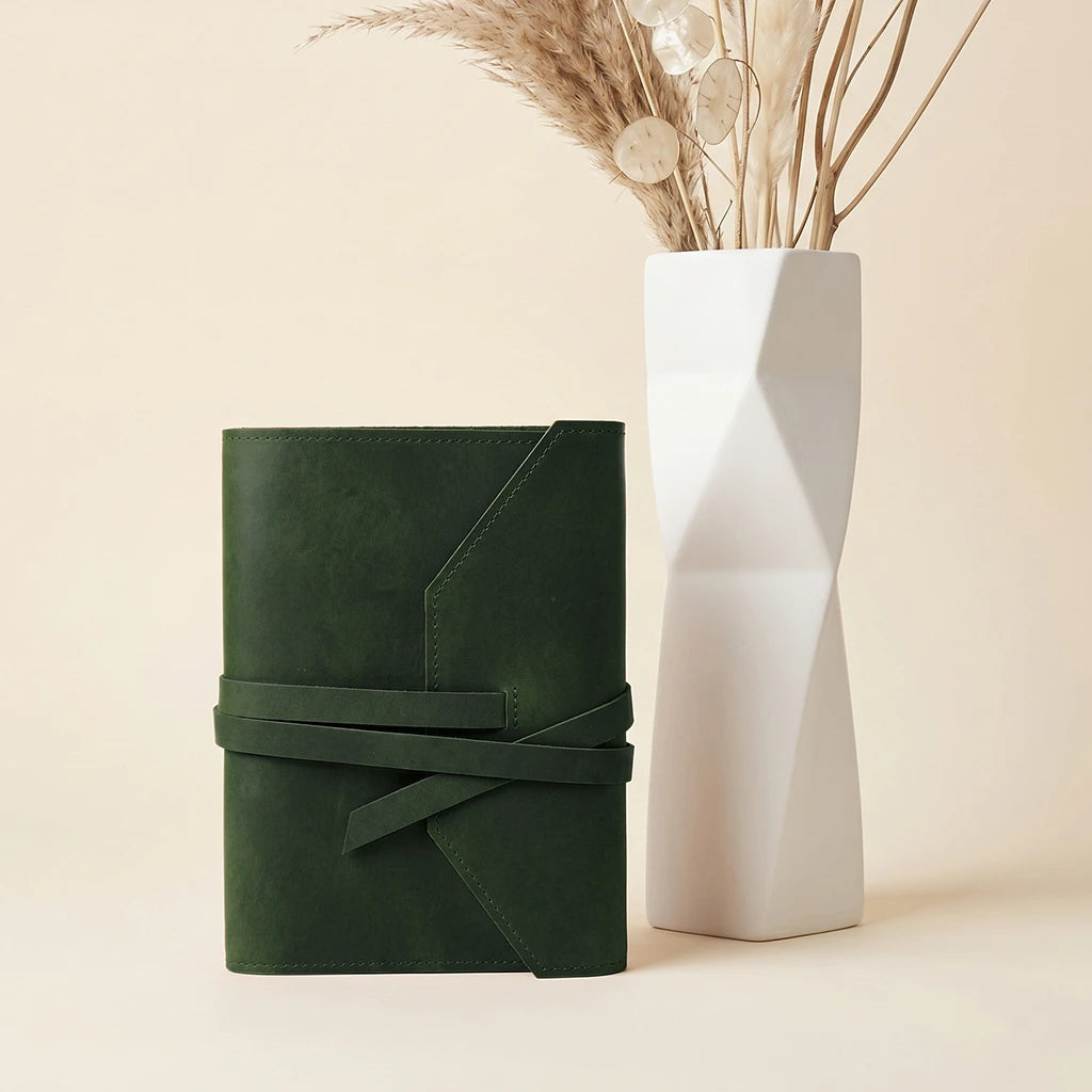 Custom leather notebook cover with strong elastic straps and pen loop.