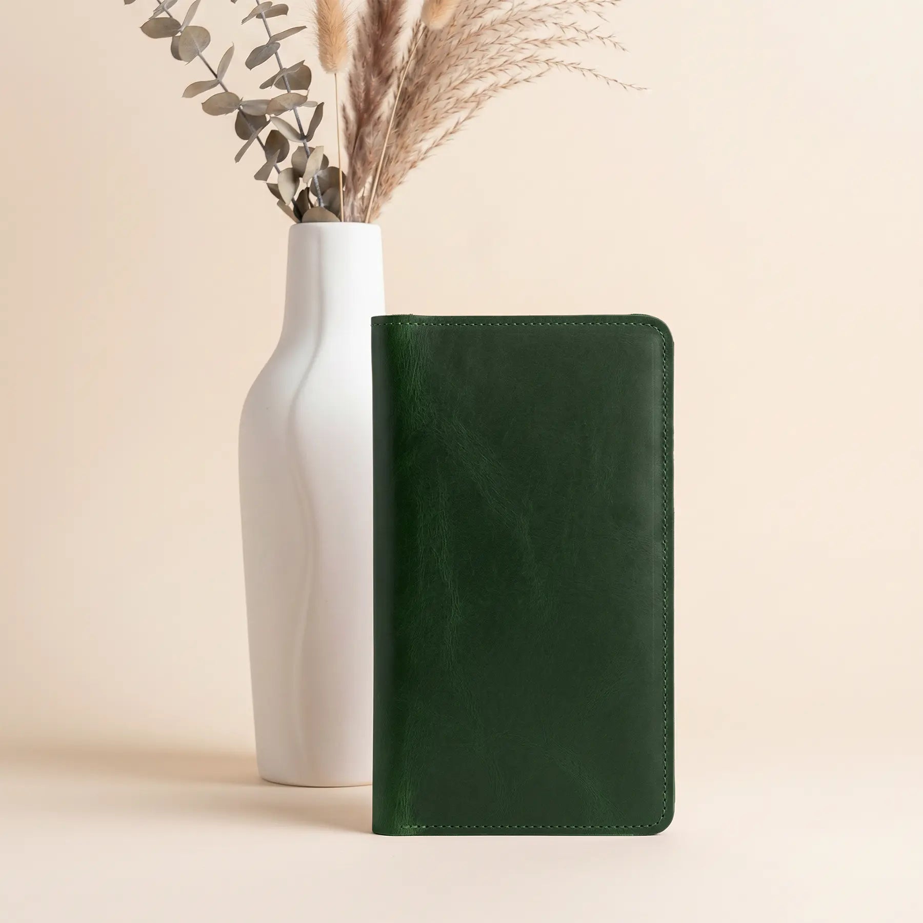 Stylish leather wallet with interior zipper pocket, card slots, and spacious cash compartments inside.