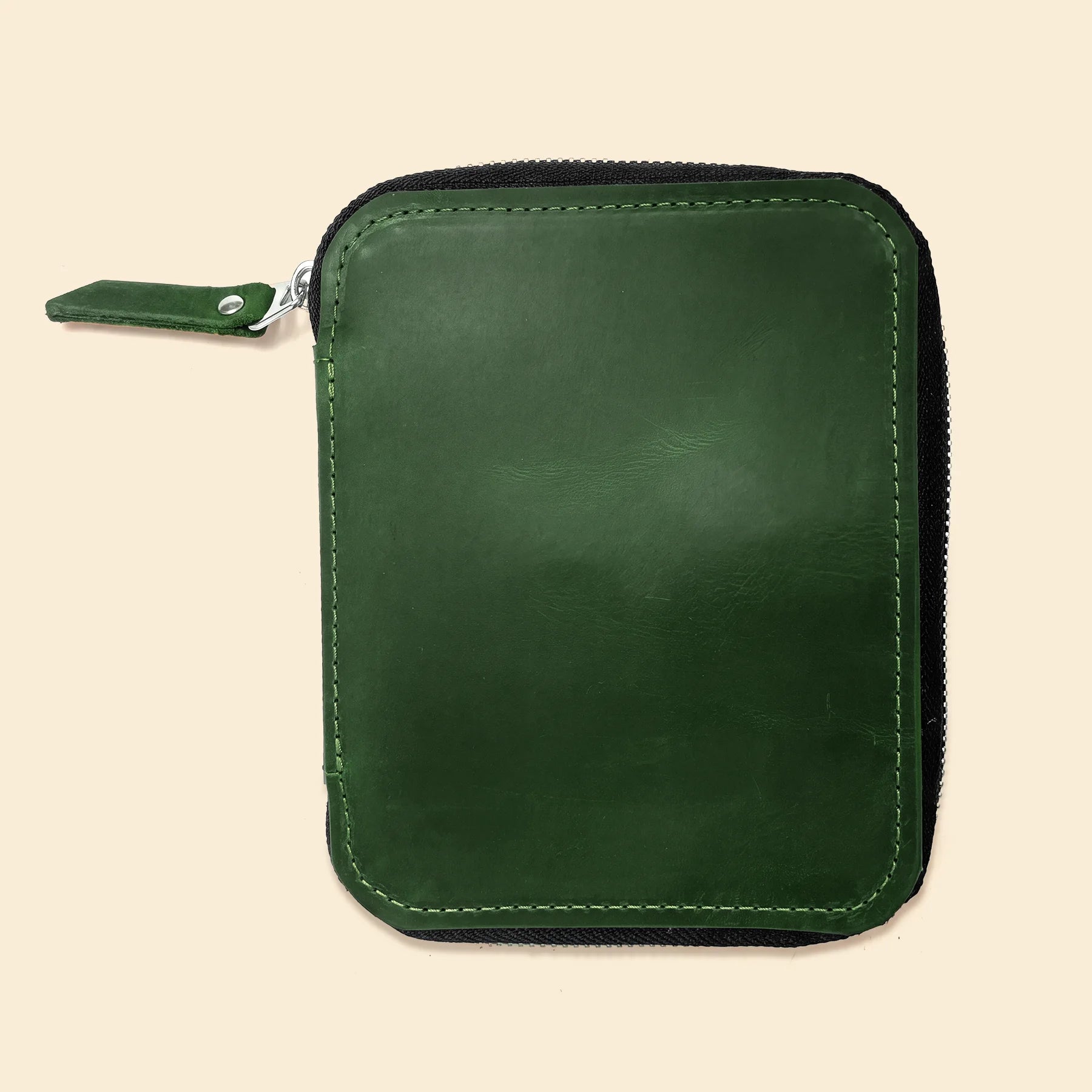 Elegant leather pen pouch with zip closure and spacious interior for stationery.