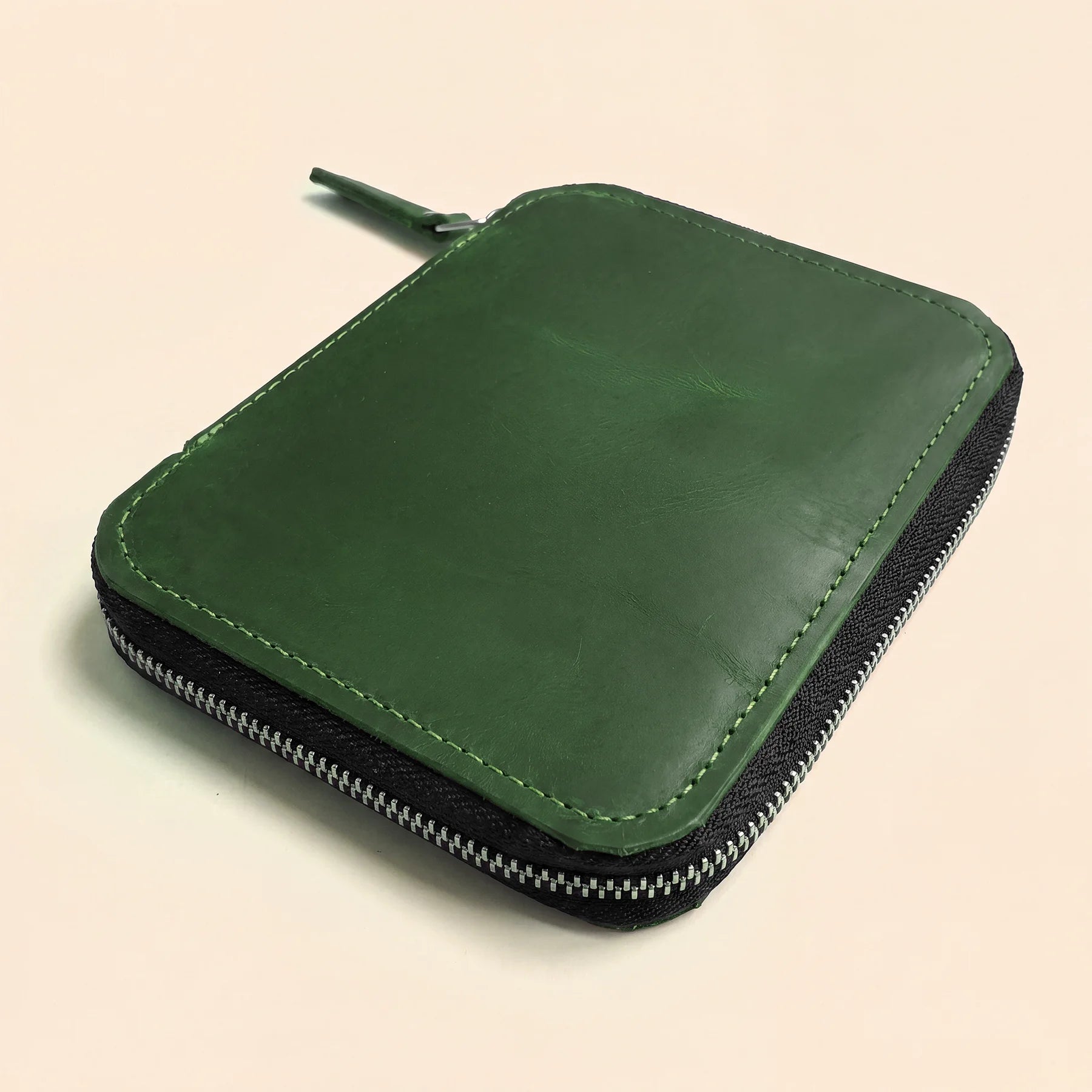 Genuine leather pen storage pouch with durable zipper and classic timeless appearance.