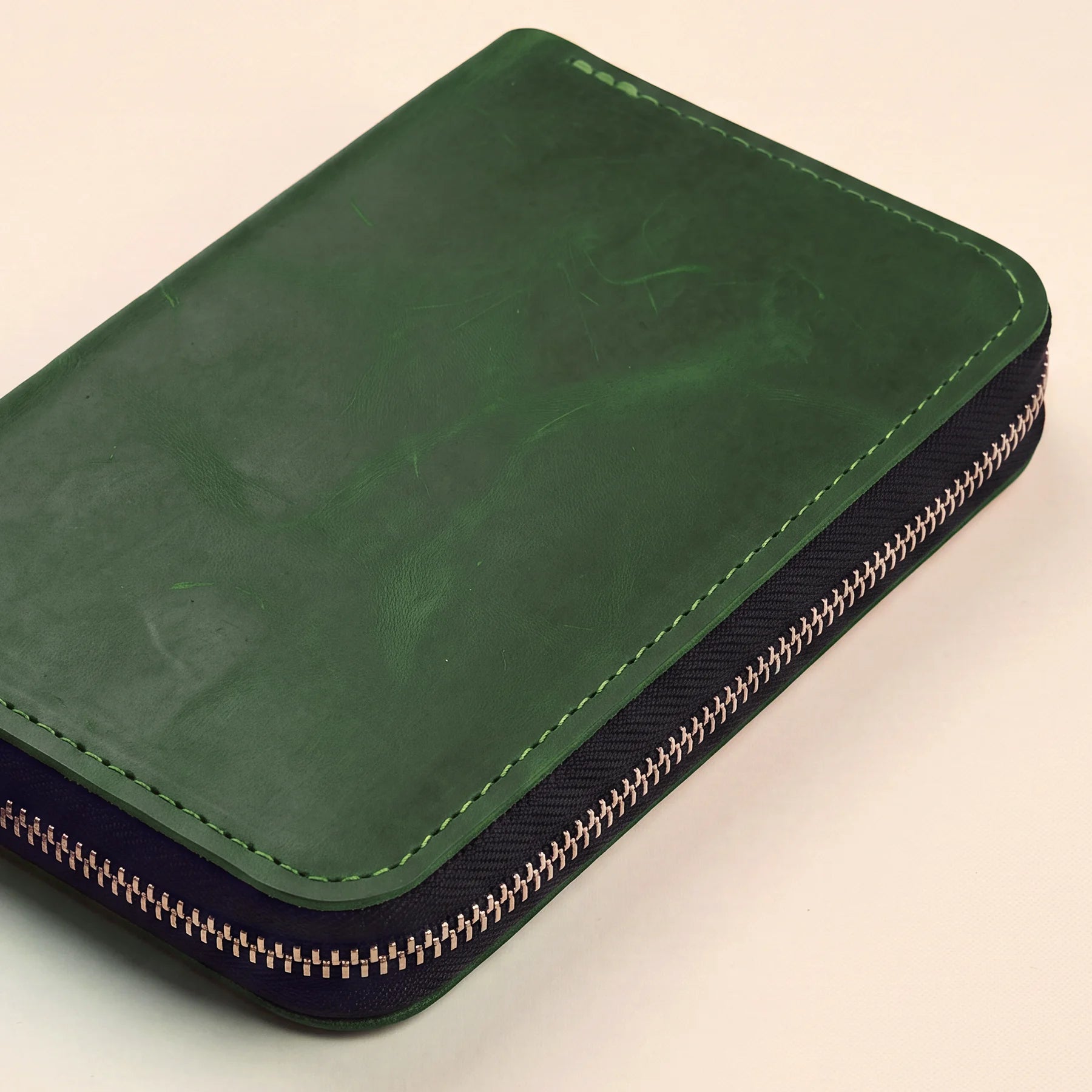 Stylish genuine leather pencil case with smooth zipper and classic minimalist design.