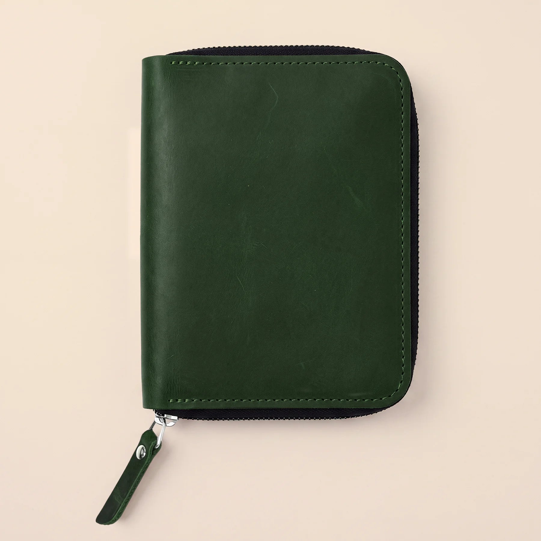 Leather writing accessory organizer with zip compartment for professional desk essentials.