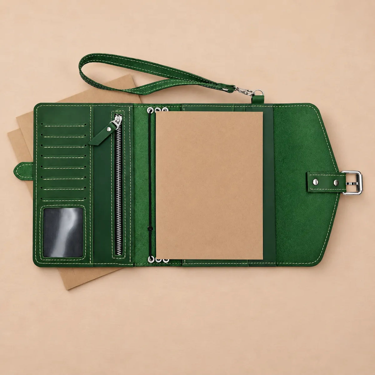 Handmade leather notebook cover with Crazy Horse finish, pockets, and carrying strap