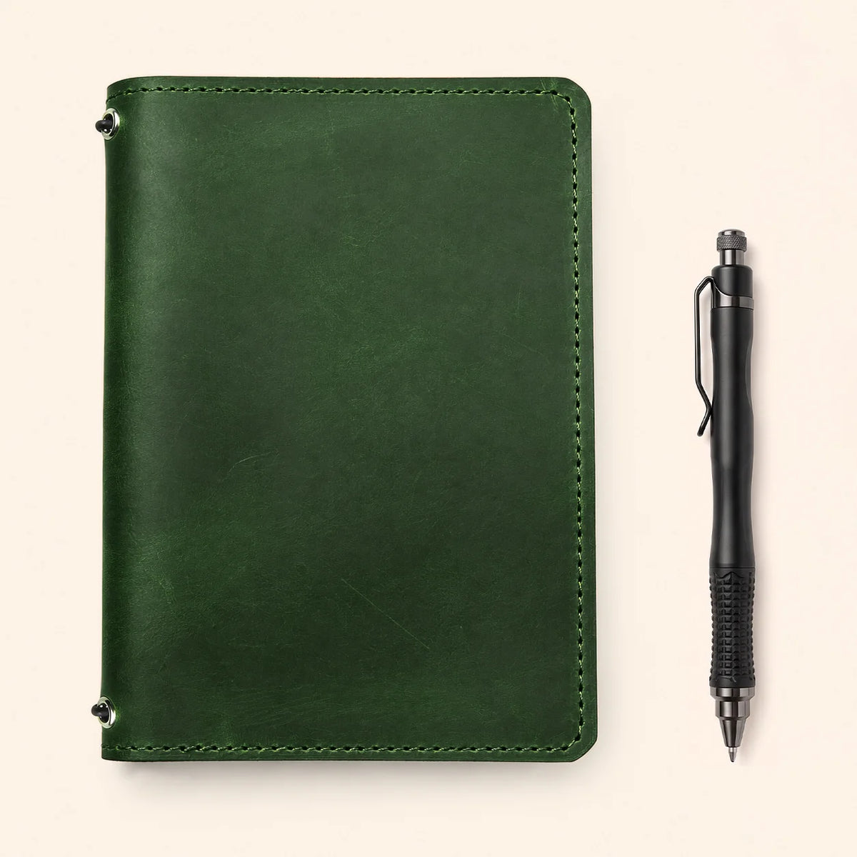 Natural leather writing cover displaying handcrafted details, two straps, and interior storage