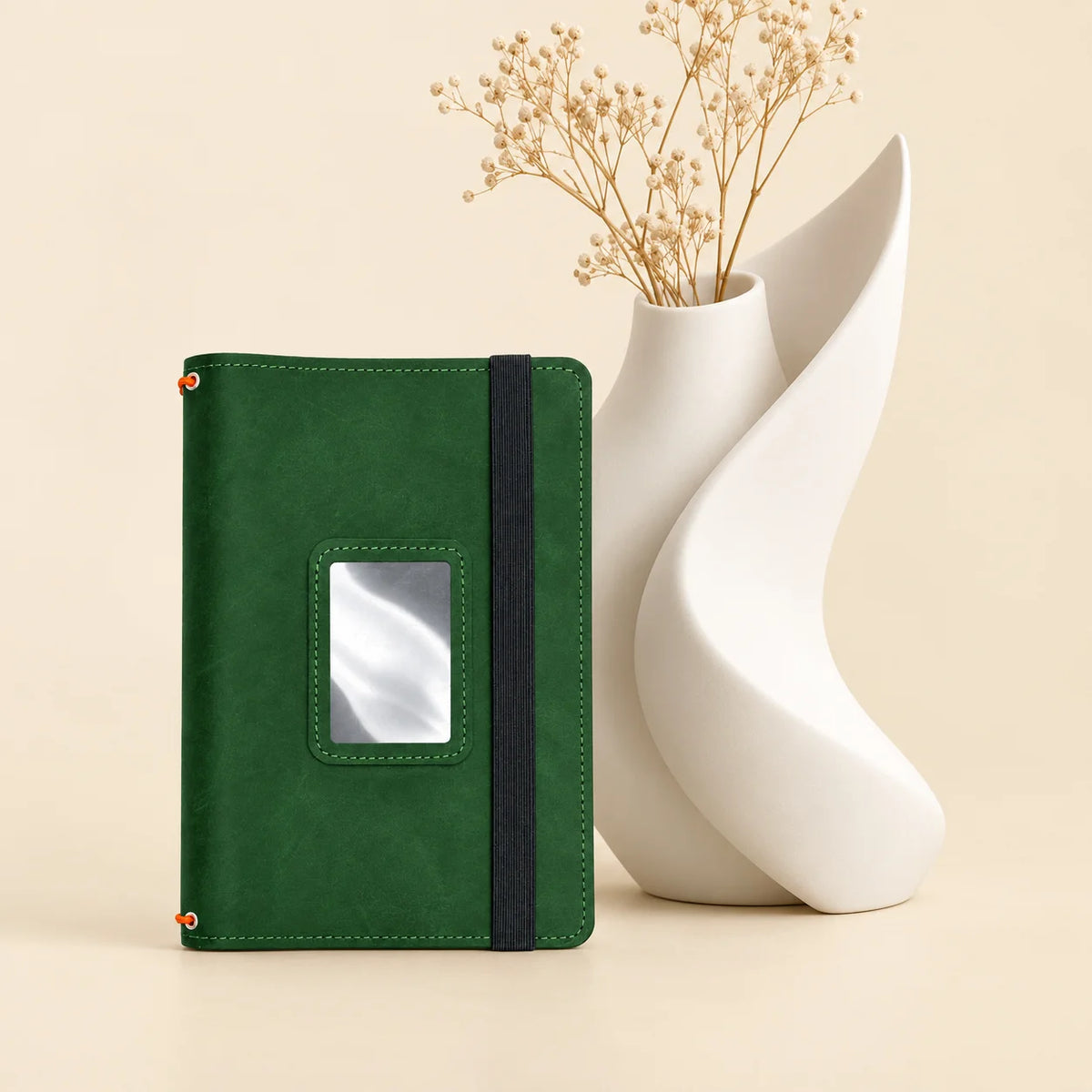 Handmade leather journal organizer featuring three straps and multiple pockets for everyday organization.
