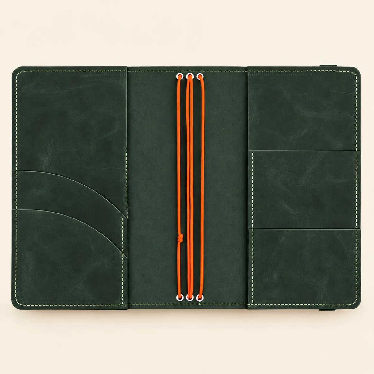 Natural leather journal featuring three flexible bands, organized pockets, and a transparent exterior photograph holder.