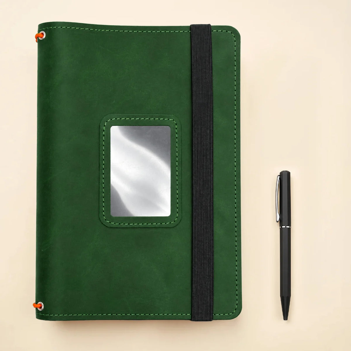 Genuine leather notebook cover displaying three flexible elastic holders and useful interior pockets.
