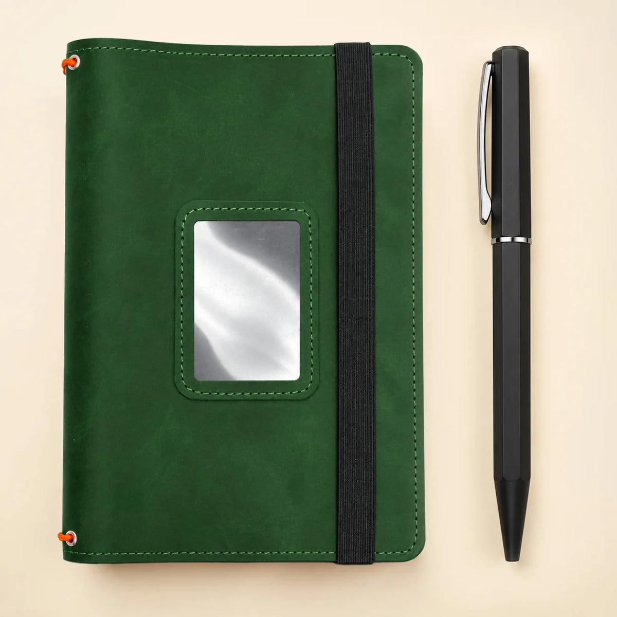 Leather journal cover made from natural leather with pockets and three elastic bands.