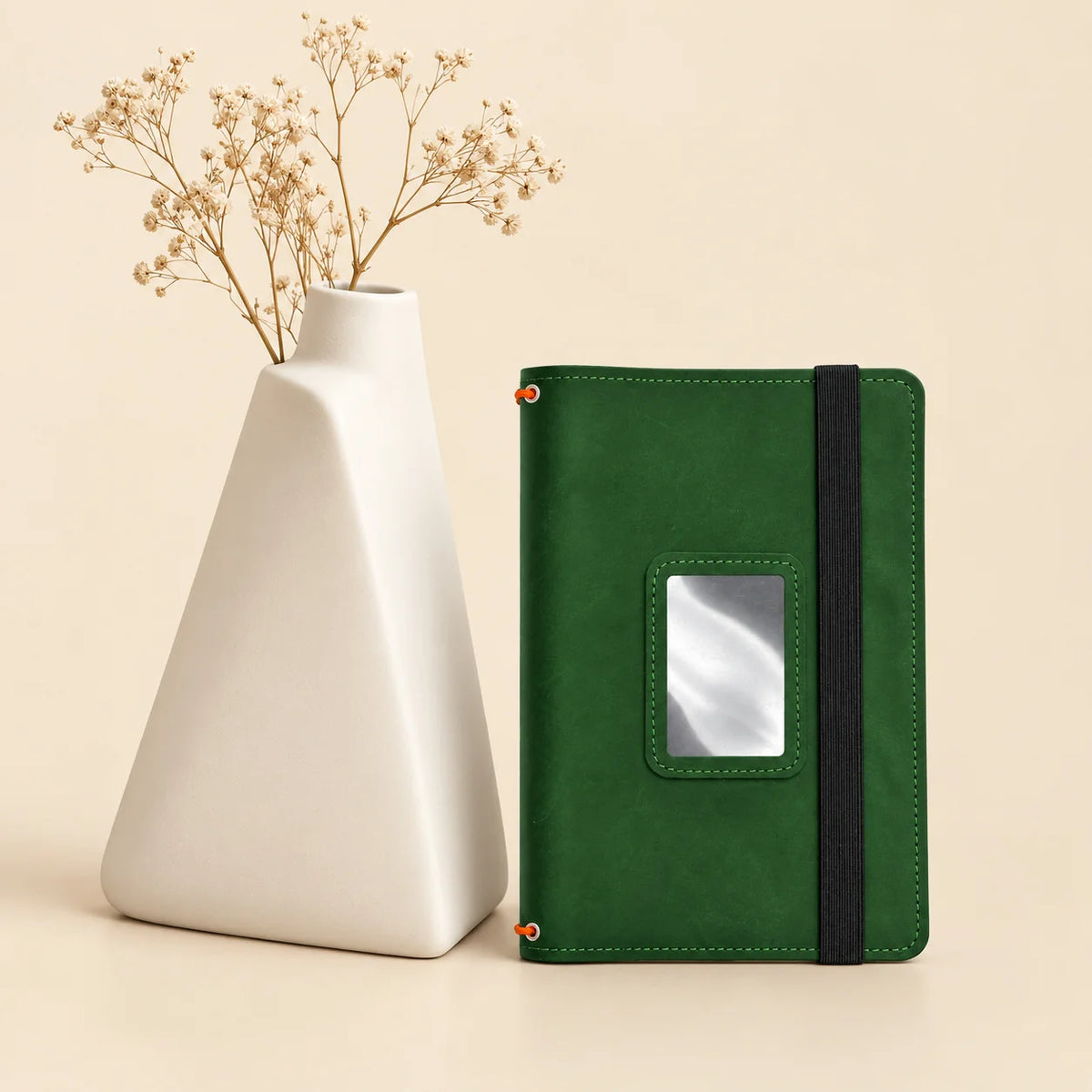 Genuine leather journal cover featuring interior pockets and three elastic bands for inserts.
