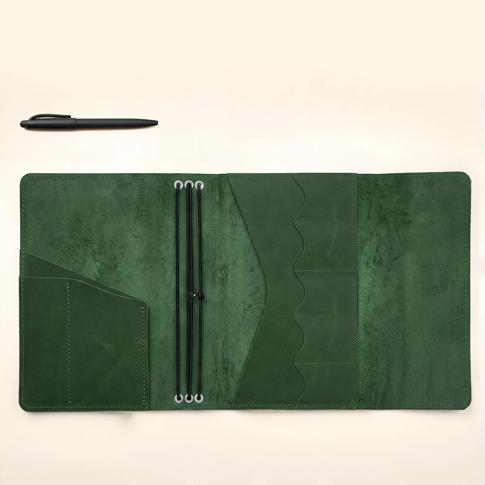 Leather journal portfolio with refillable notebook design and interior card storage pockets.