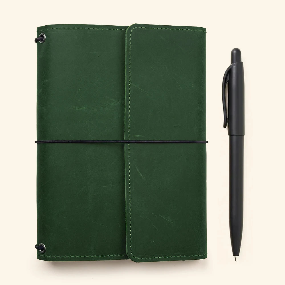 Premium leather notebook organizer designed with refillable inserts and built-in pen holder.
