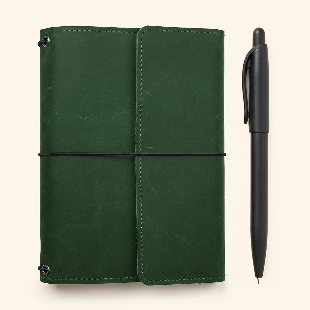 Leather notebook cover designed with refillable elastic bands and spacious internal storage pockets.