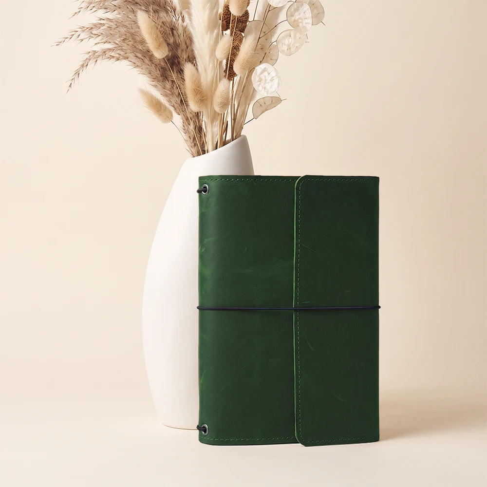 Premium handcrafted notebook organizer with elastic notebook loops and interior utility compartments.