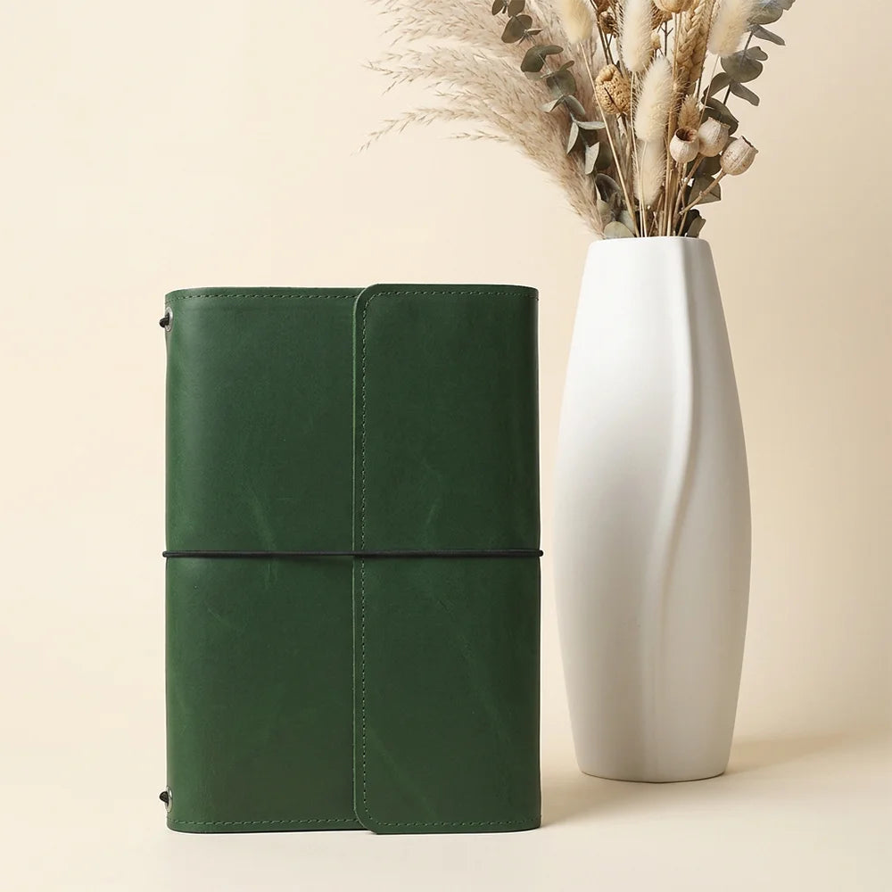 Handmade leather notebook cover showcasing quality stitching, spacious pockets, and secure pen storage.