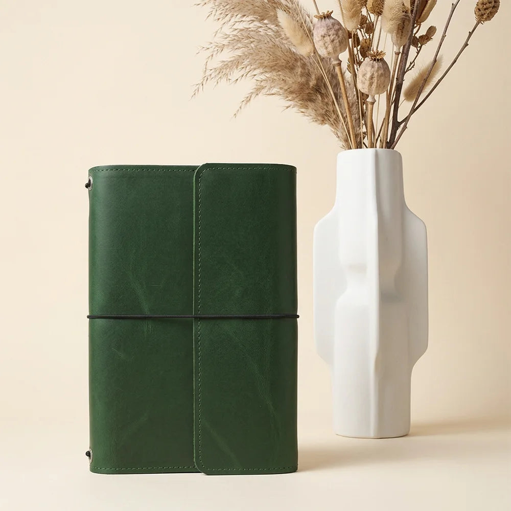 Natural hide journal cover with interior sections for organizing cards, notes, and writing essentials.