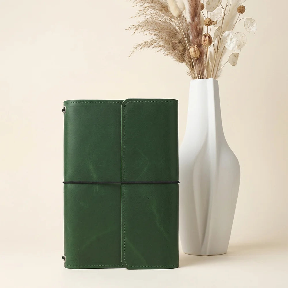 Handmade genuine leather cover featuring convenient pockets and a built-in pen loop