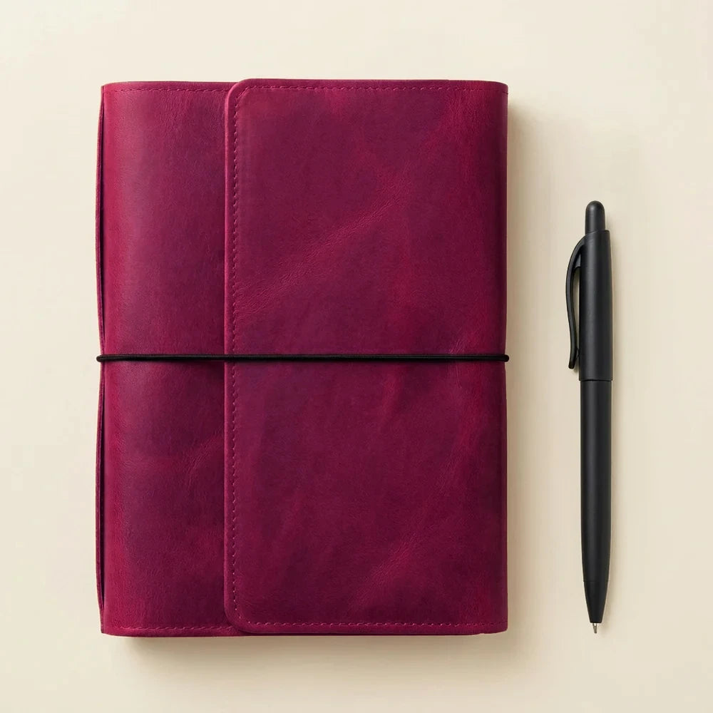 Leather notebook organizer with six elastic bands and spacious pockets for everyday essentials.