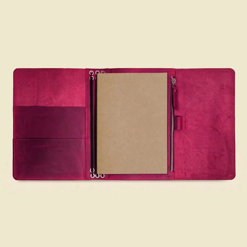 Genuine leather notebook case with six elastic bands and built-in interior pockets.