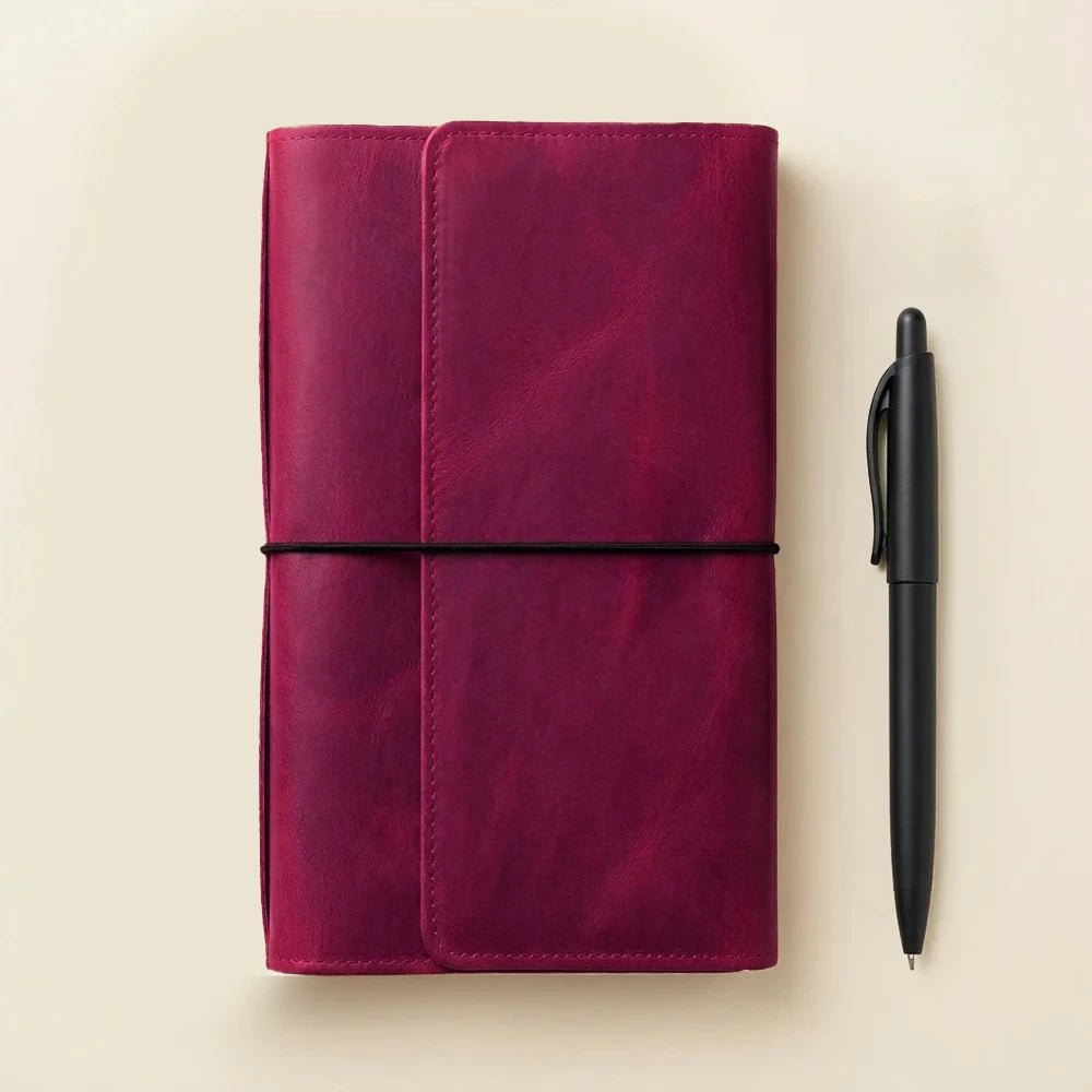 Leather journal cover featuring six elastic bands for interchangeable notebooks and inserts.