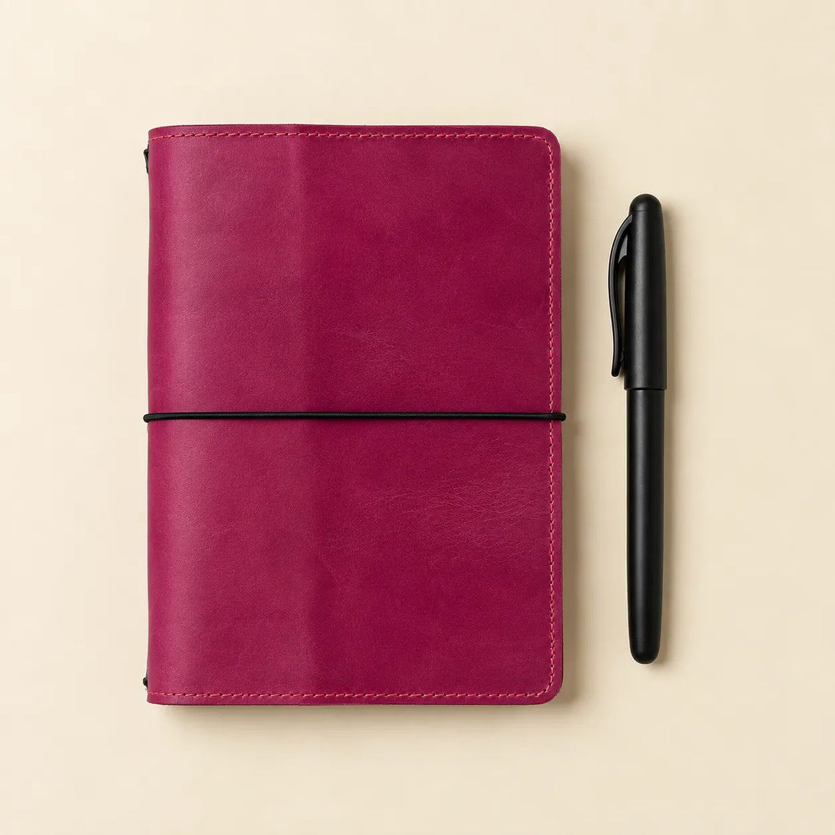 Pink natural Crazy Horse leather notebook featuring a soft pink finish and interior storage pockets.