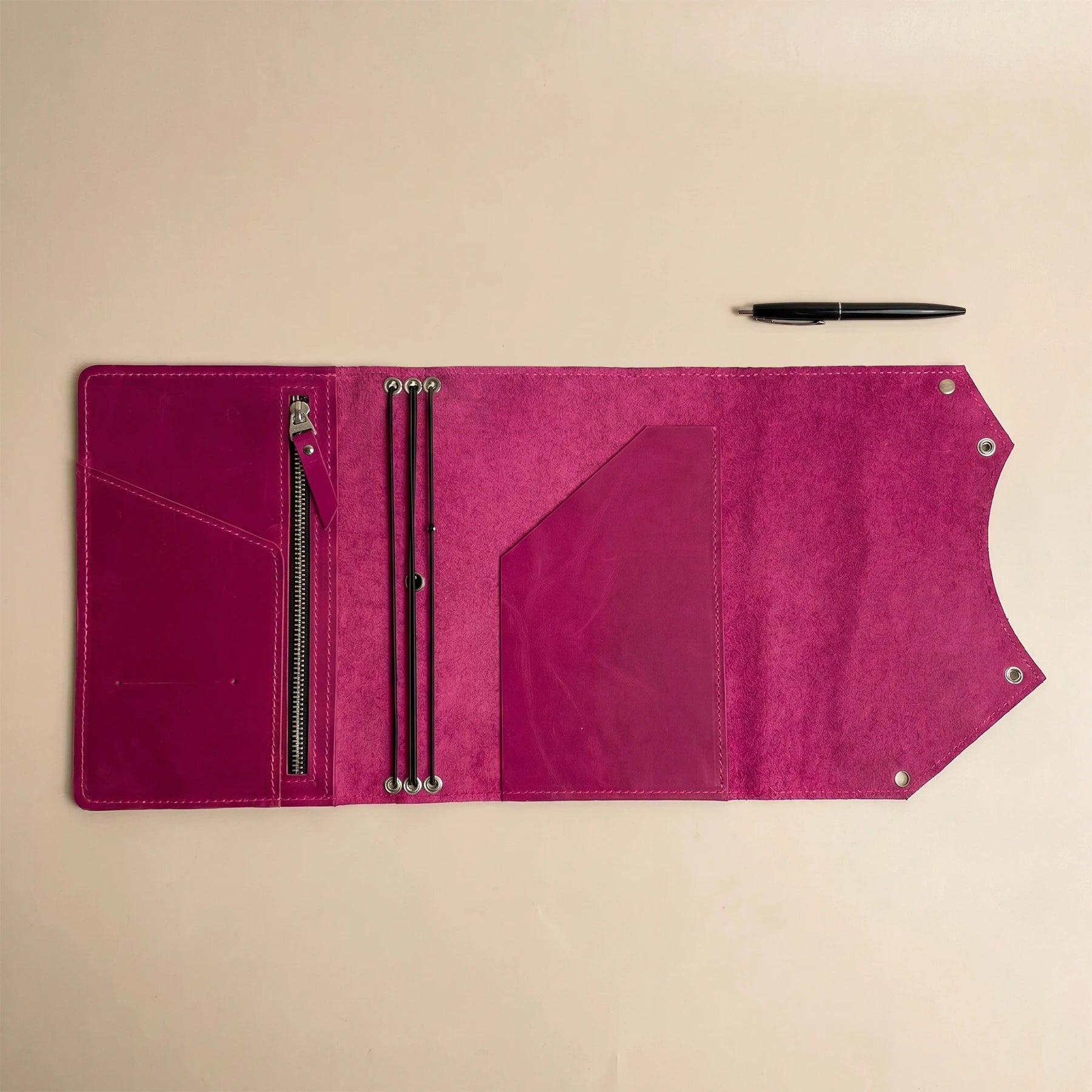 Premium handmade notebook cover featuring functional zipper compartment and durable genuine leather construction.