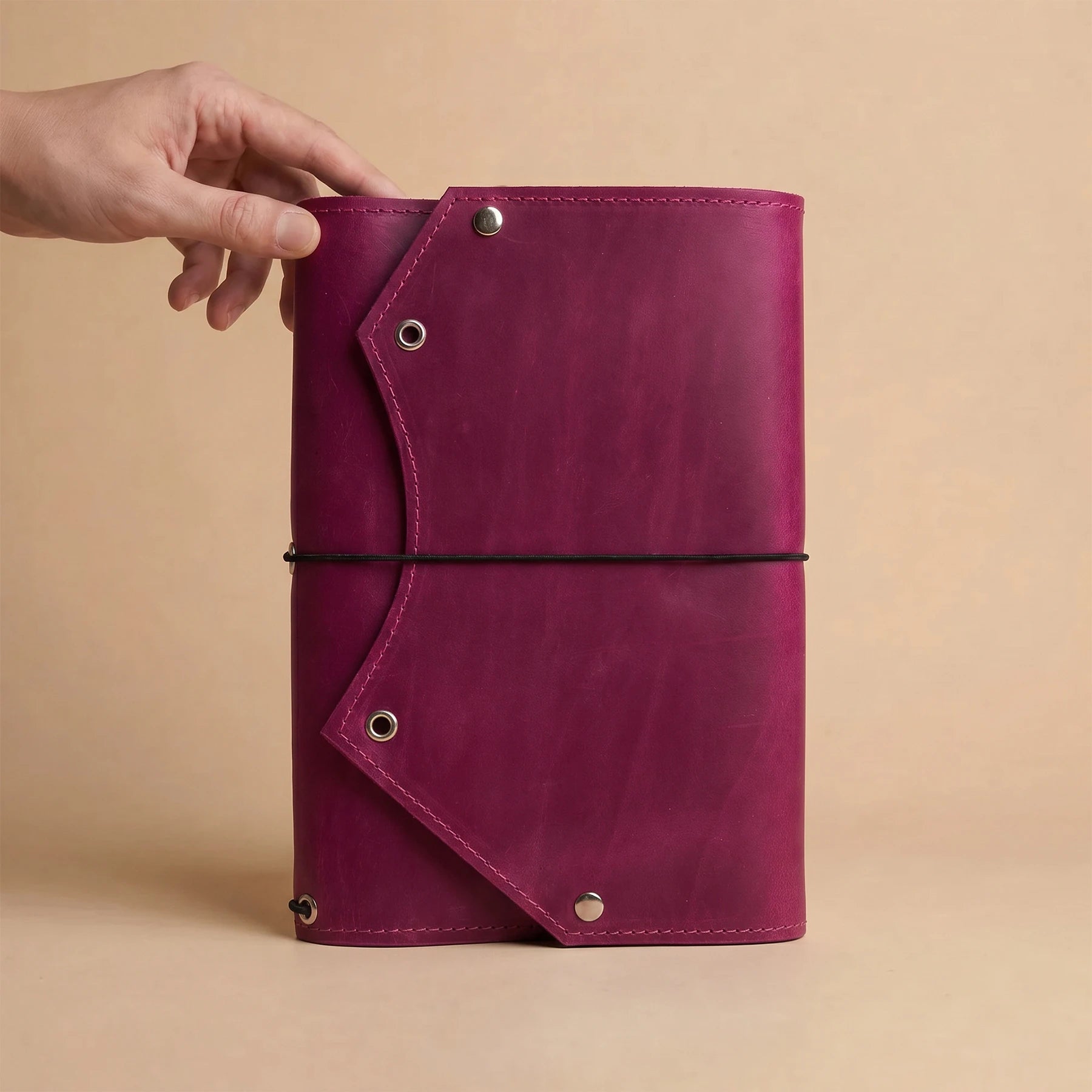 Rustic leather planner organizer with spacious zipper compartment inside for valuable everyday accessories.