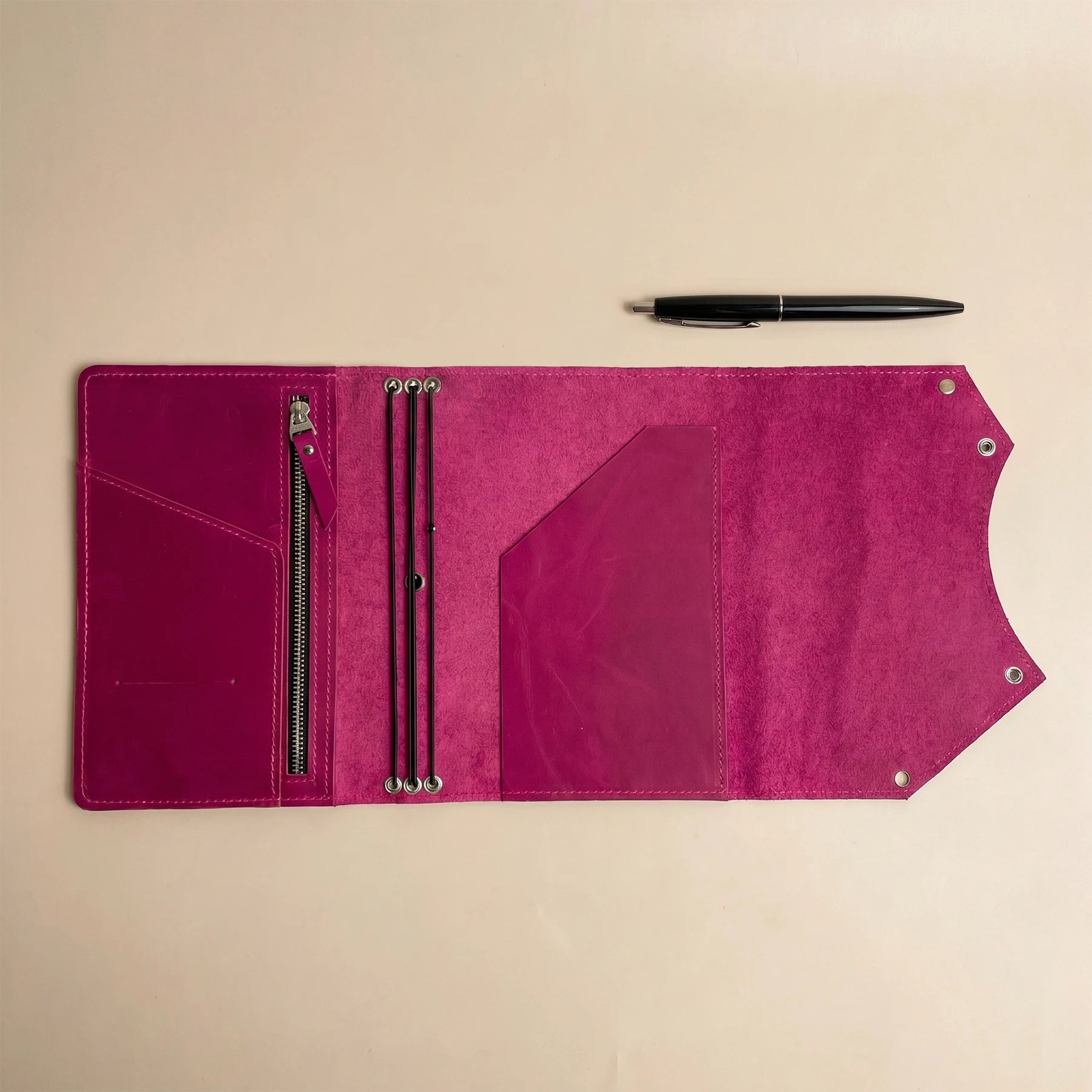 Leather notebook holder featuring secure interior zipper pocket and timeless handcrafted craftsmanship.