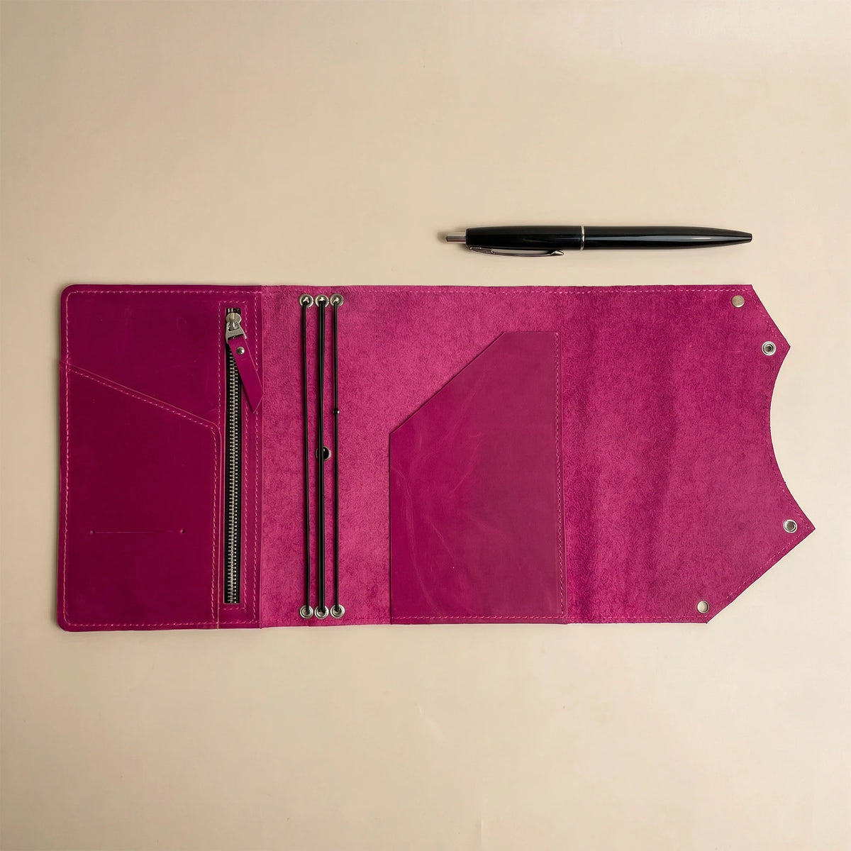 Leather notebook organizer with interior zip pocket for cards, cash, and small essentials.