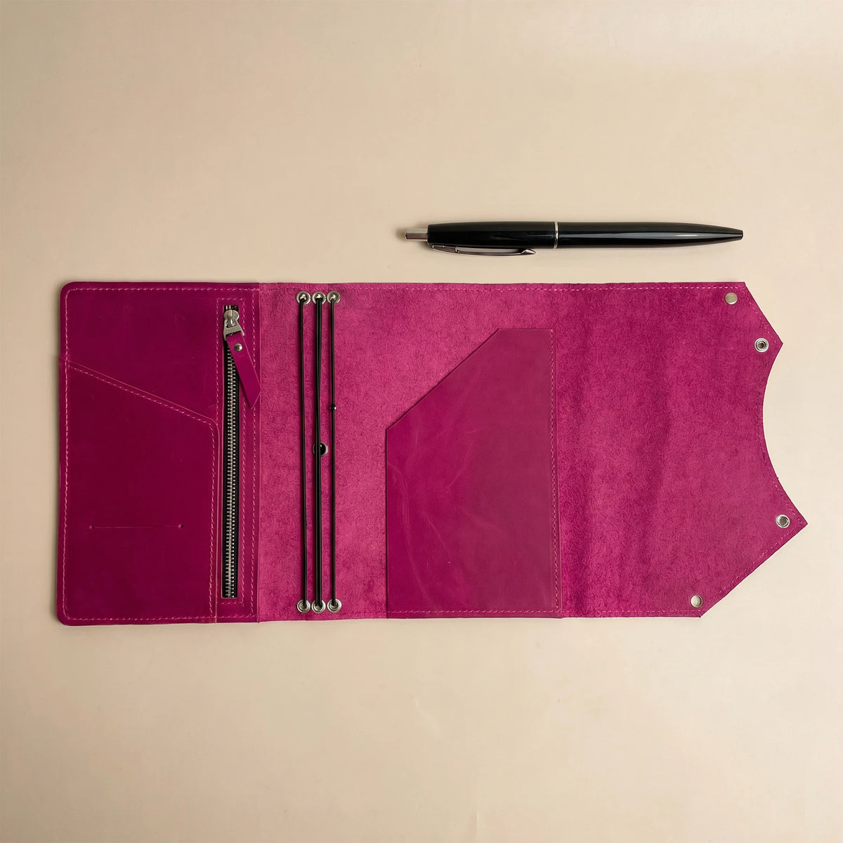 Handmade leather notebook cover with secure interior zipper pocket for organized everyday essentials.