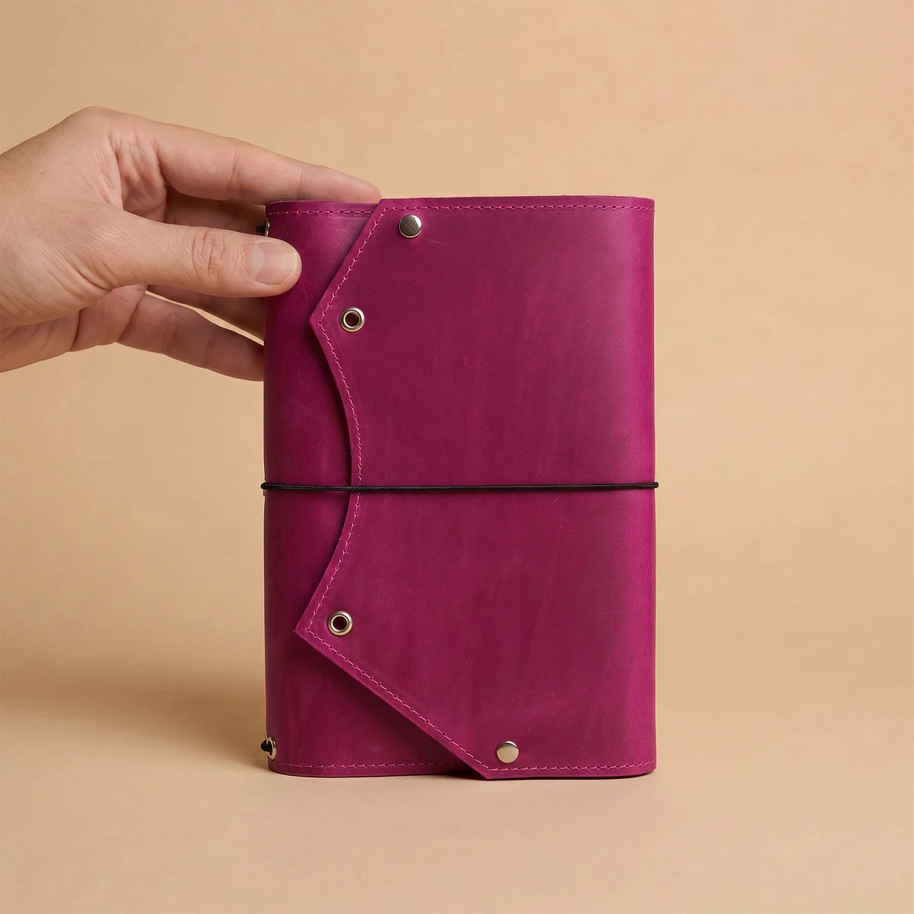 Refillable leather notebook cover with practical interior zipper compartment for accessories and notes.