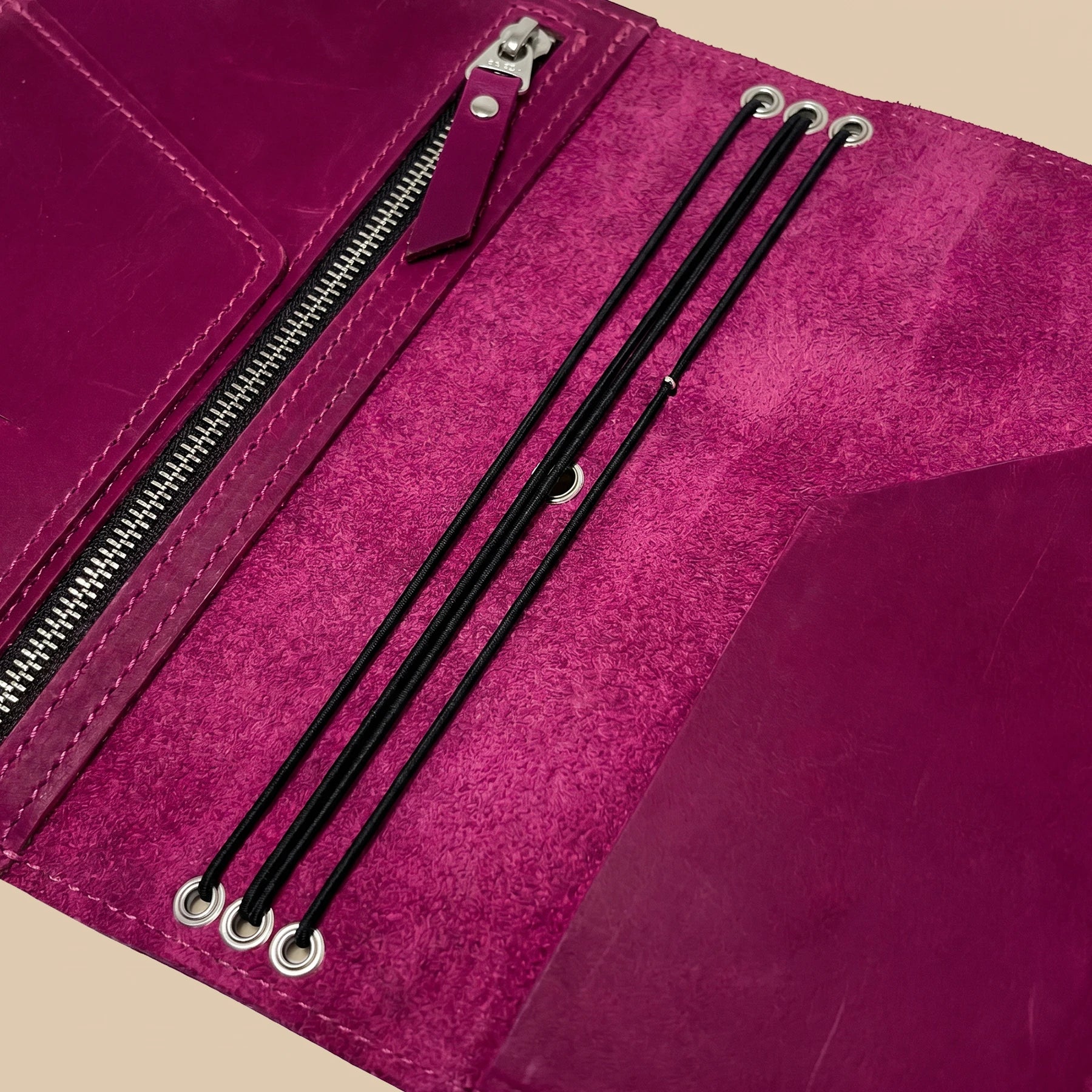 Genuine leather notebook cover with handcrafted zipper compartment for organized daily essentials.