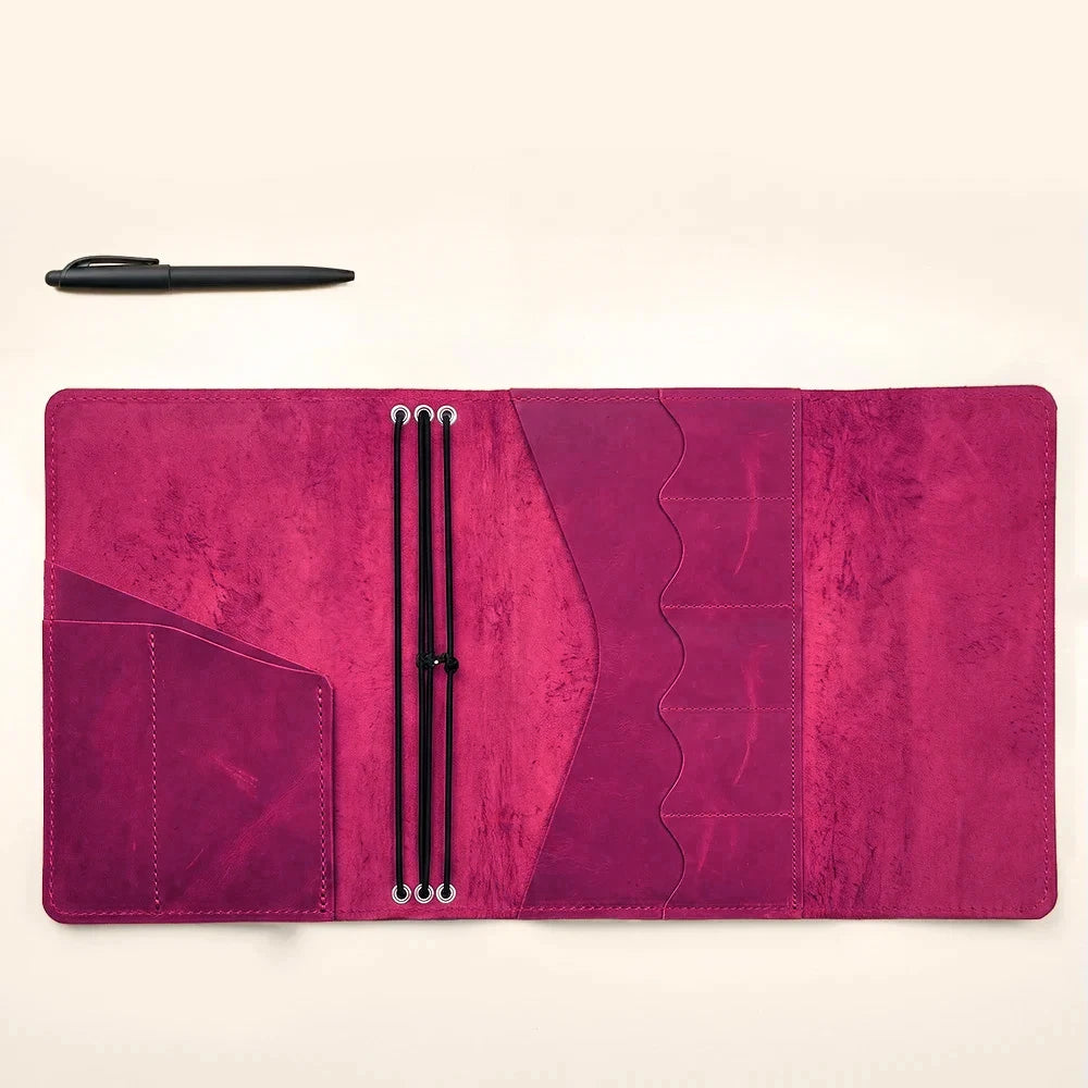 Handmade leather journal cover with three elastic closures and spacious storage pockets