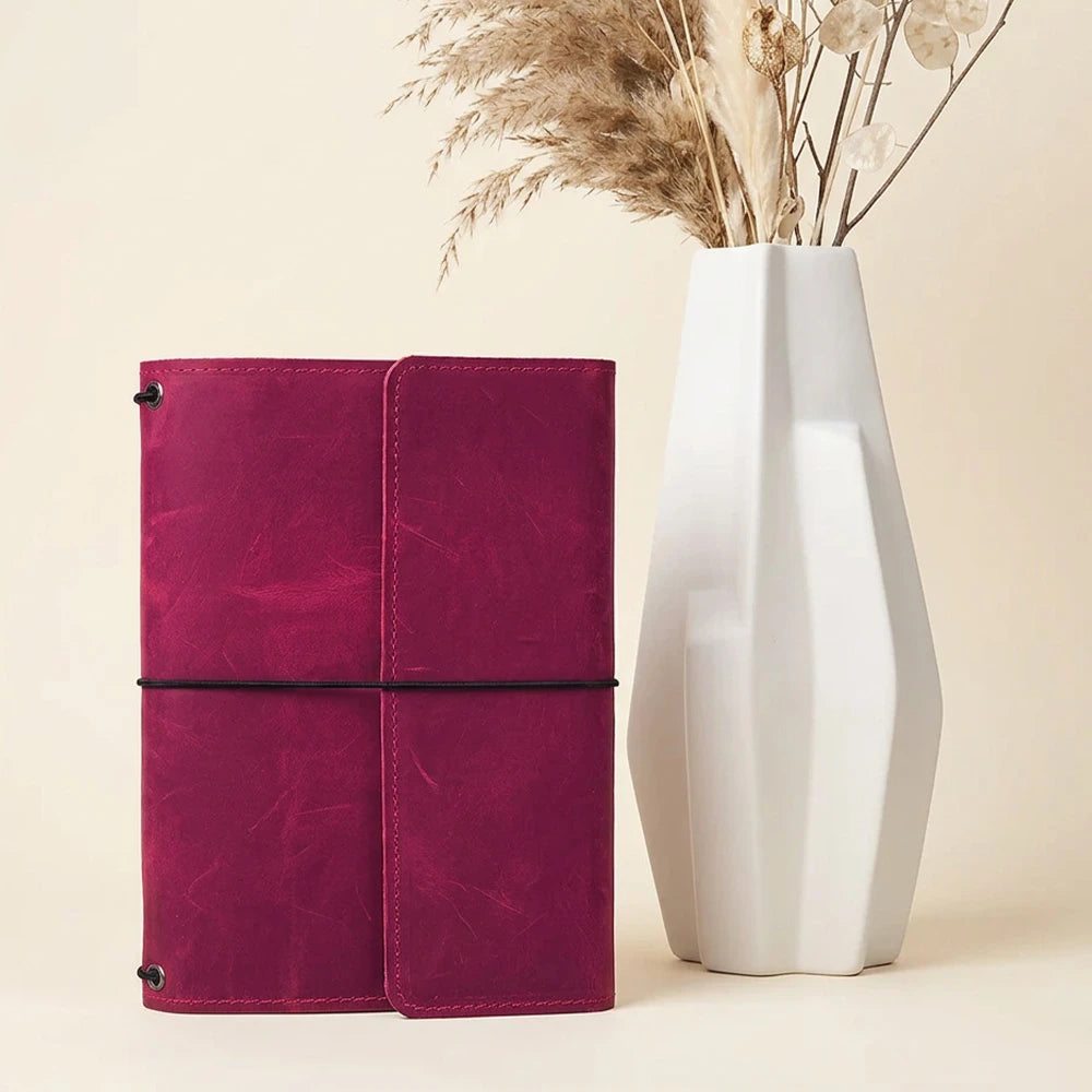 Genuine leather notebook cover featuring three elastic bands and functional compartments