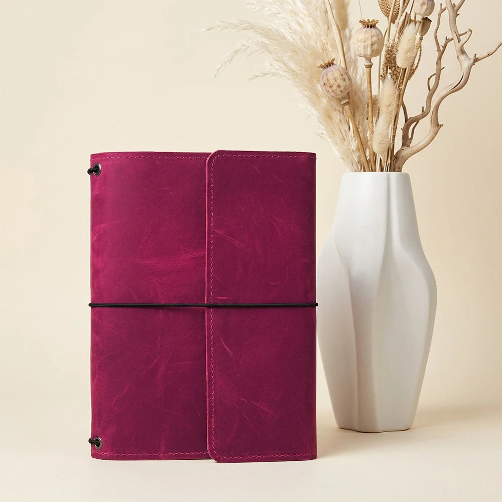 Leather journal cover featuring three elastic bands and convenient card pockets