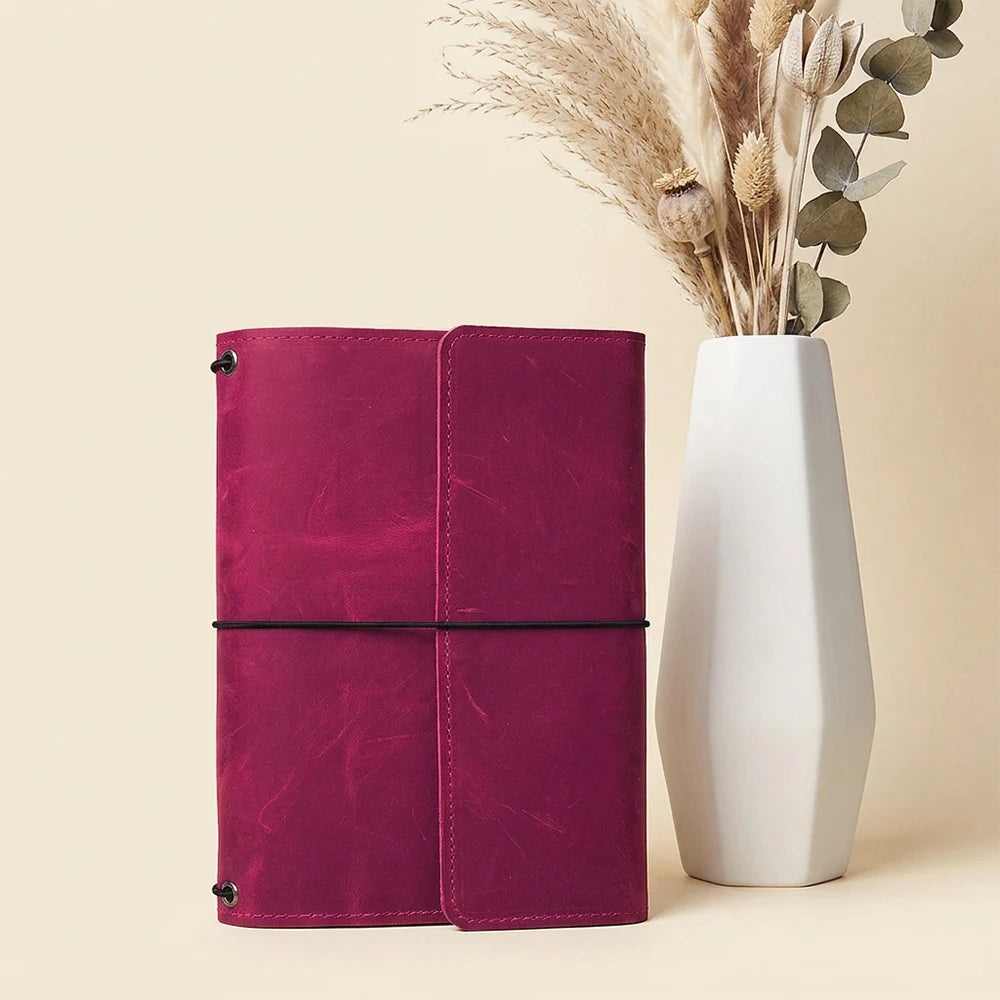 Genuine leather notebook cover with three elastic bands and organized storage compartments
