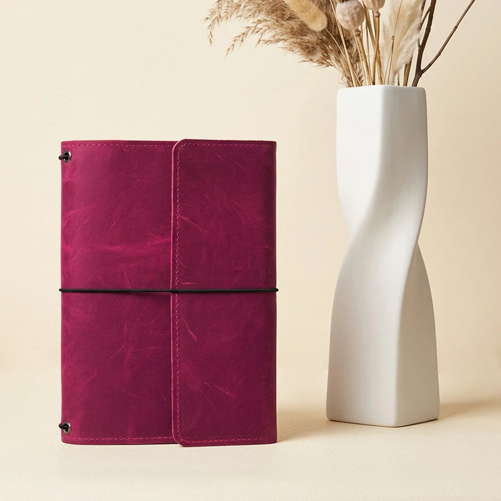Genuine leather notebook cover featuring three elastic bands and spacious pockets
