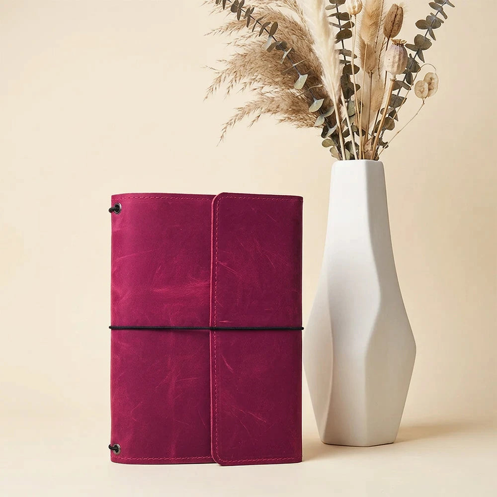 Leather notebook cover with three elastic bands for holding notebooks securely