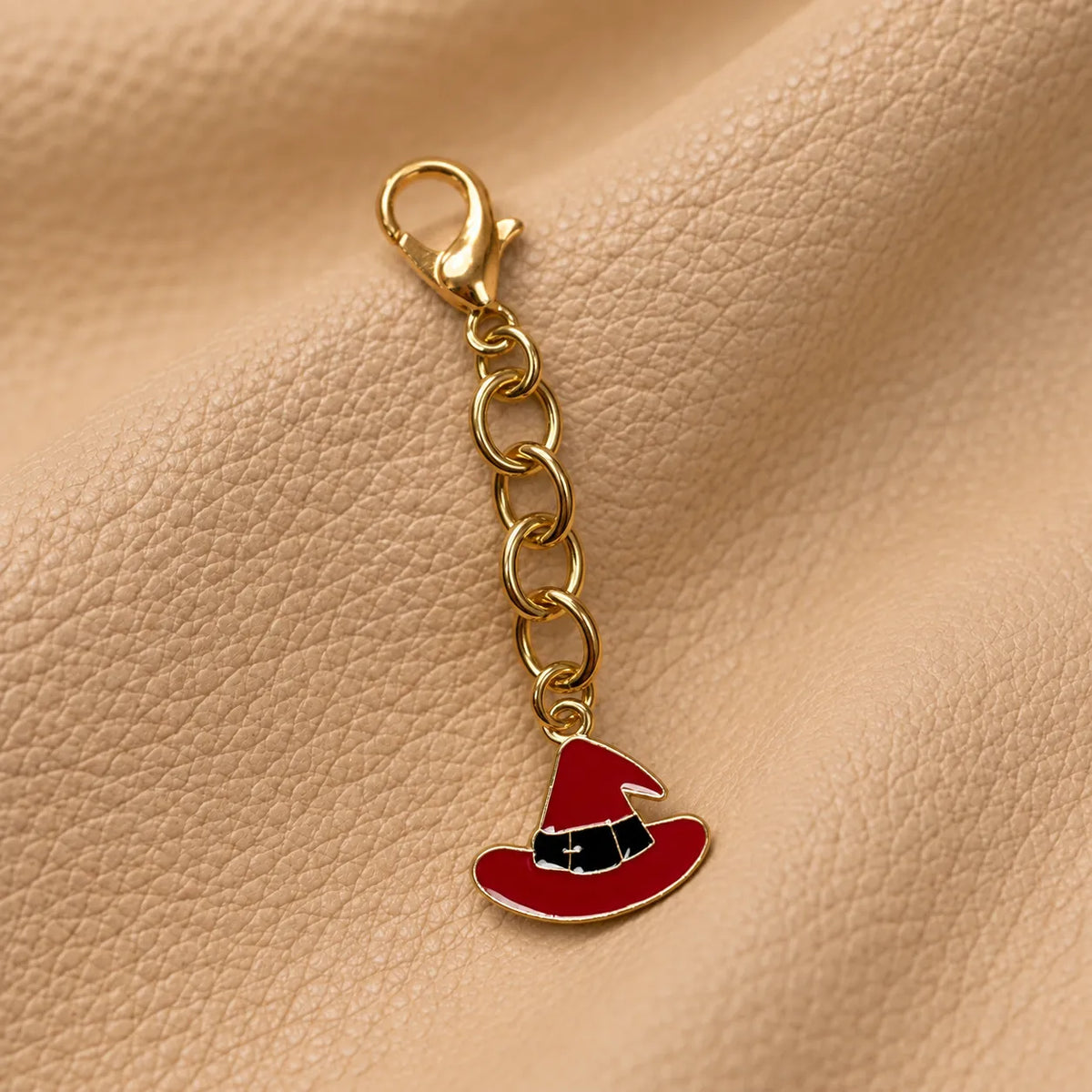 Delicate charm bead hanging from a notebook cover for added visual appeal.