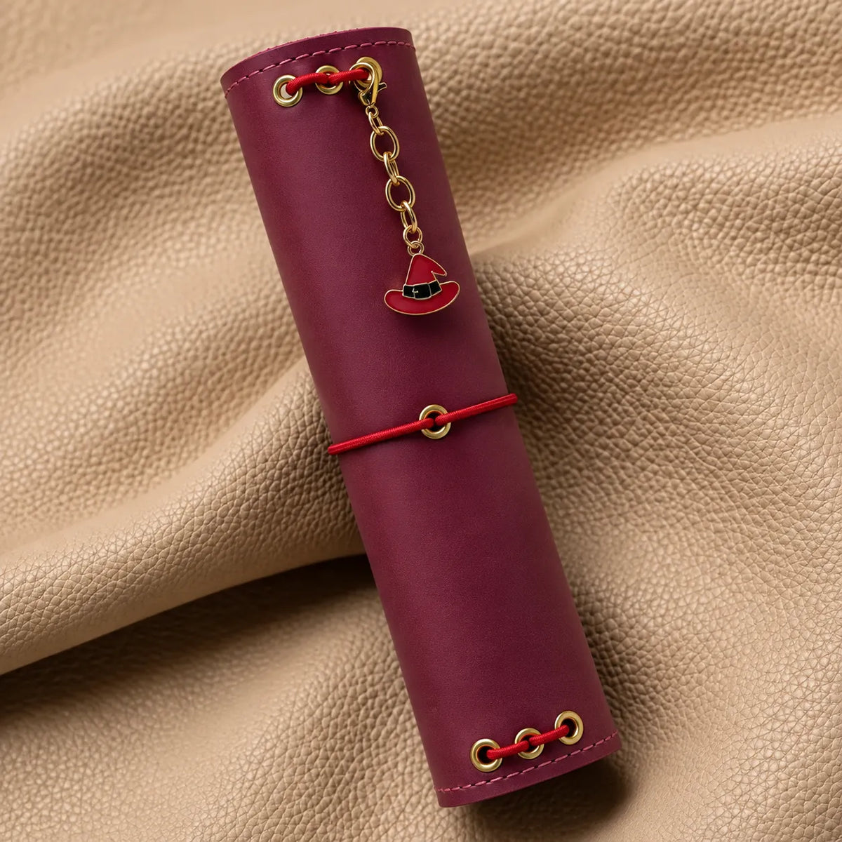 Beautiful journal accessory featuring a bead charm attached to a leather notebook.