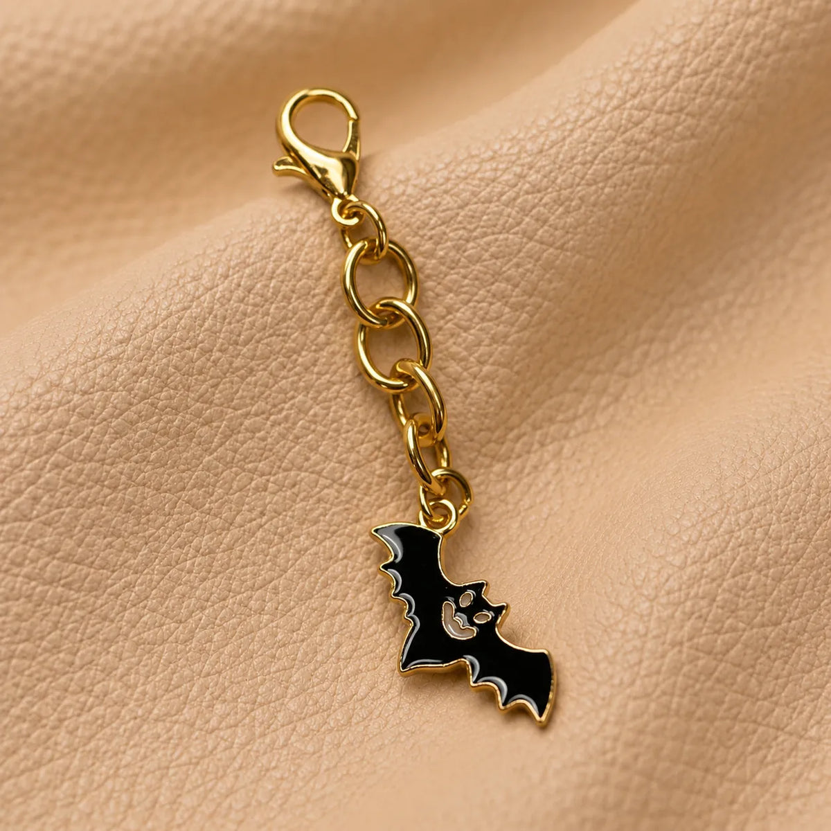 Decorative beaded charm adorning a leather notebook with a delicate hanging design.