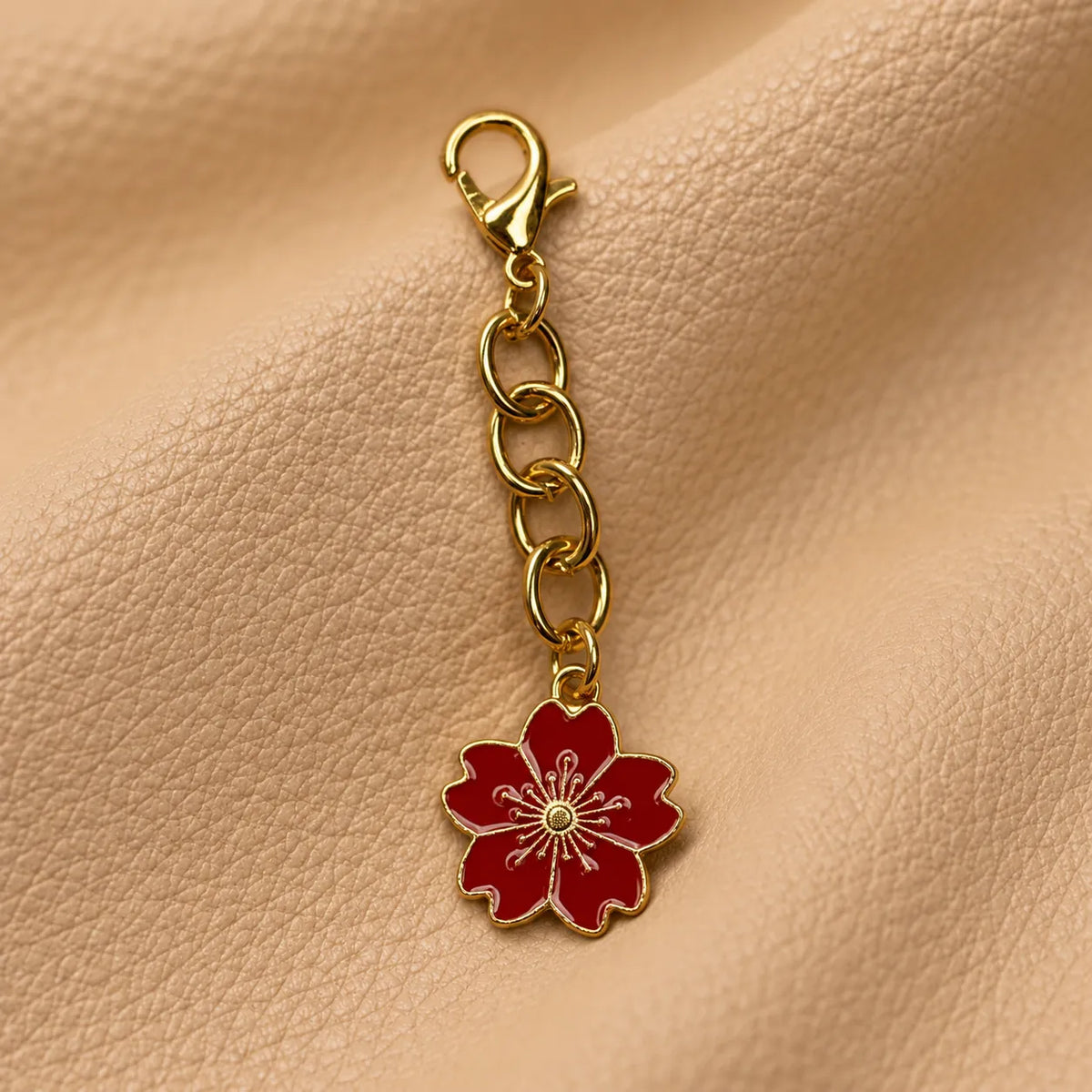 Delicate beaded charm decorating a leather journal cover with a graceful hanging detail.
